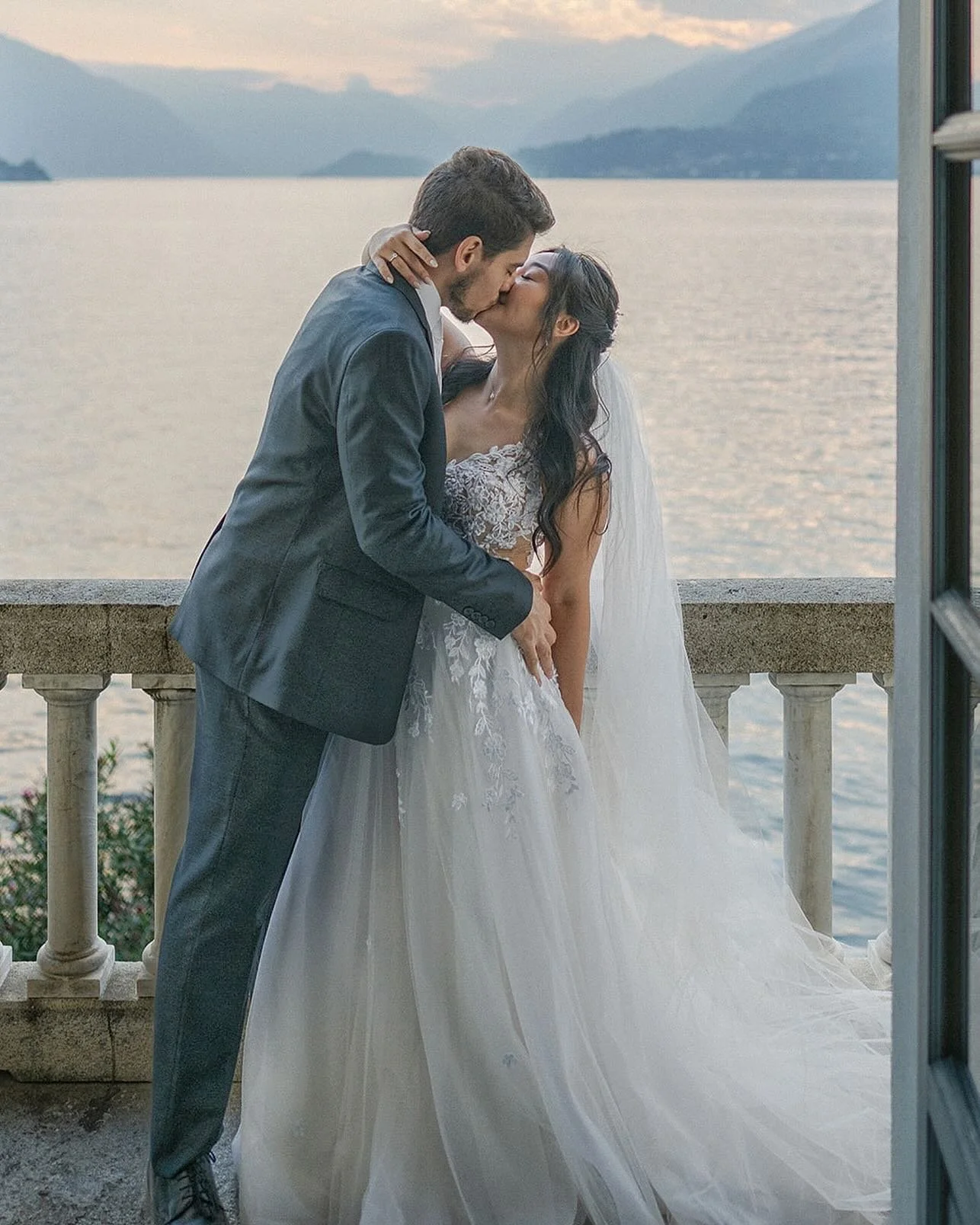 An intimate elopement in Varenna, framed by the timeless beauty of Villa Monastero.
On this quiet balcony overlooking Lake Como, love becomes the only horizon.

Every photograph is a story whispered between the couple and the lake&mdash;a moment susp