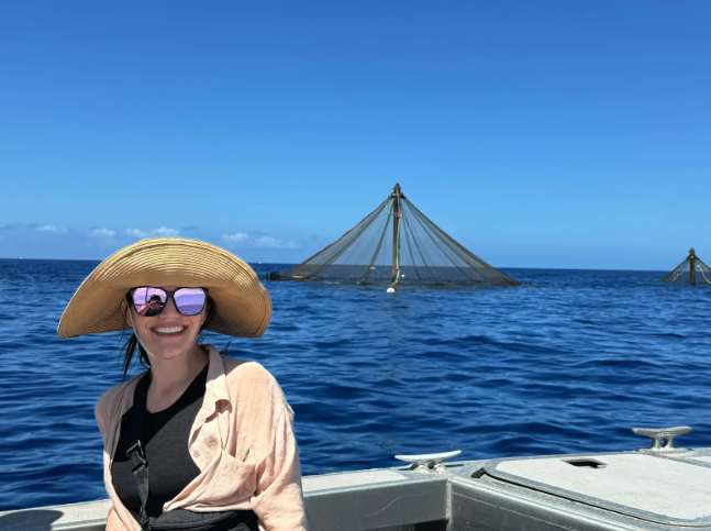 Caitlin Wege, CEO of Knip, visiting a farm run by Blue Ocean Mariculture in Hawaii