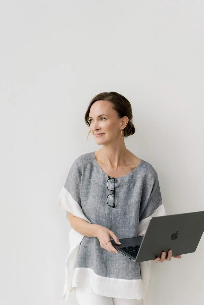 Portrait of Erin Holding her computer