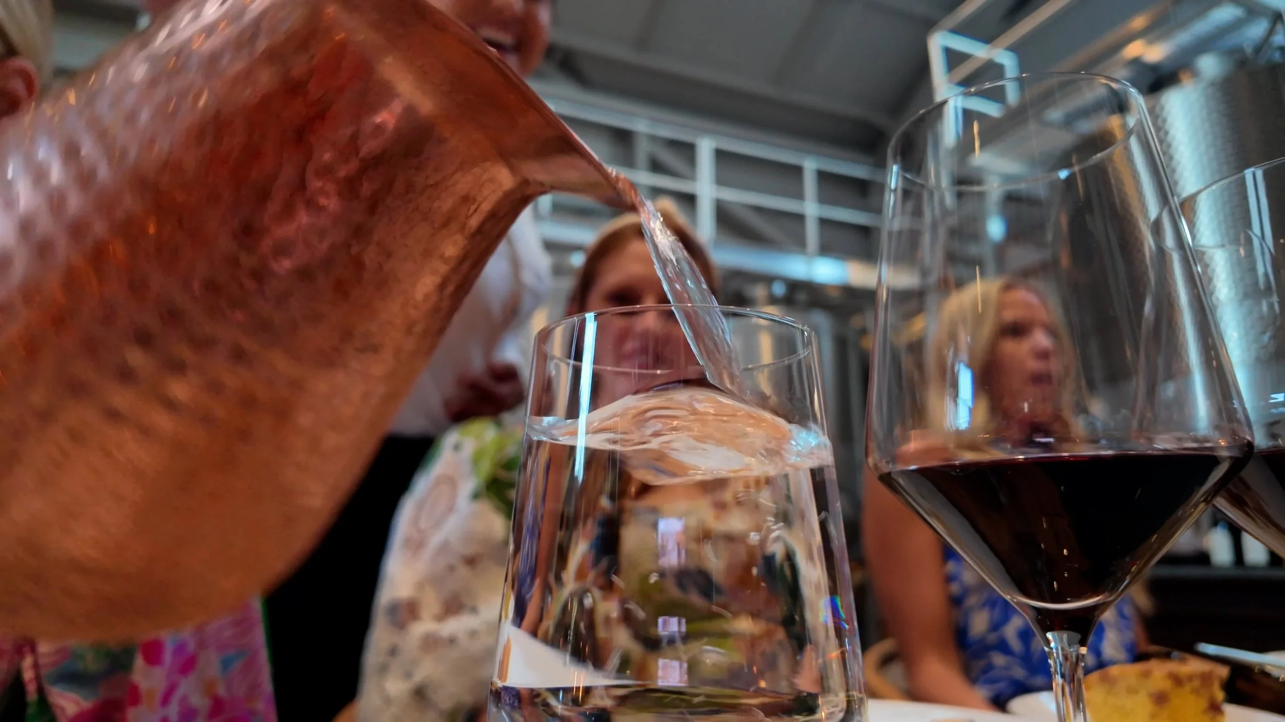 glass being filled with water at a Winery in California