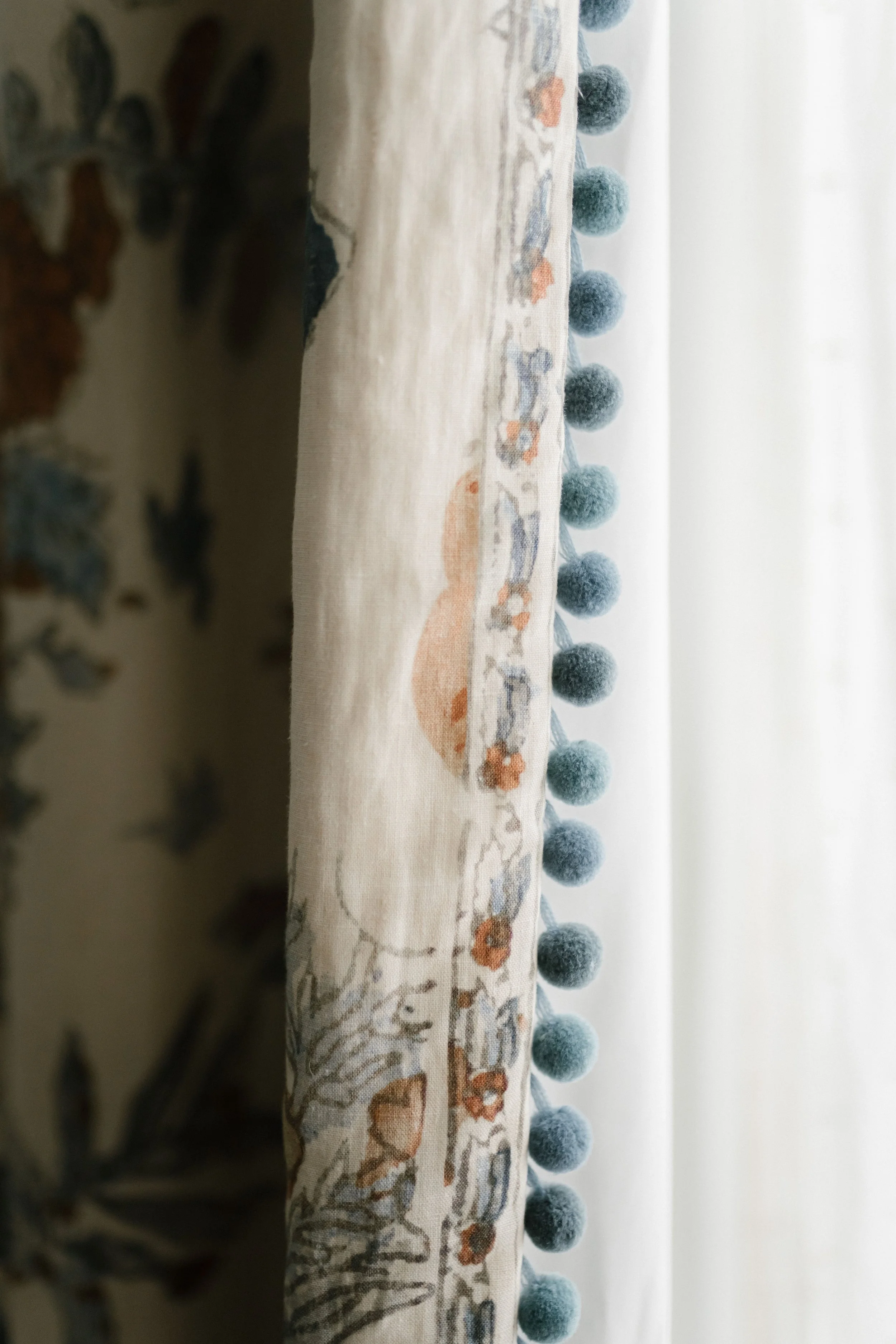 White curtain with blue pattern