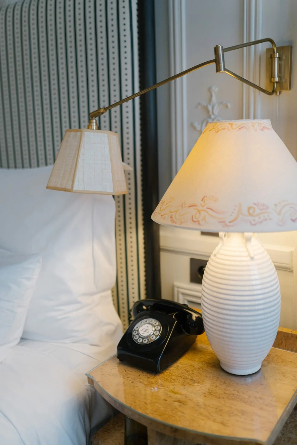 Lamp and telephone on nightstand