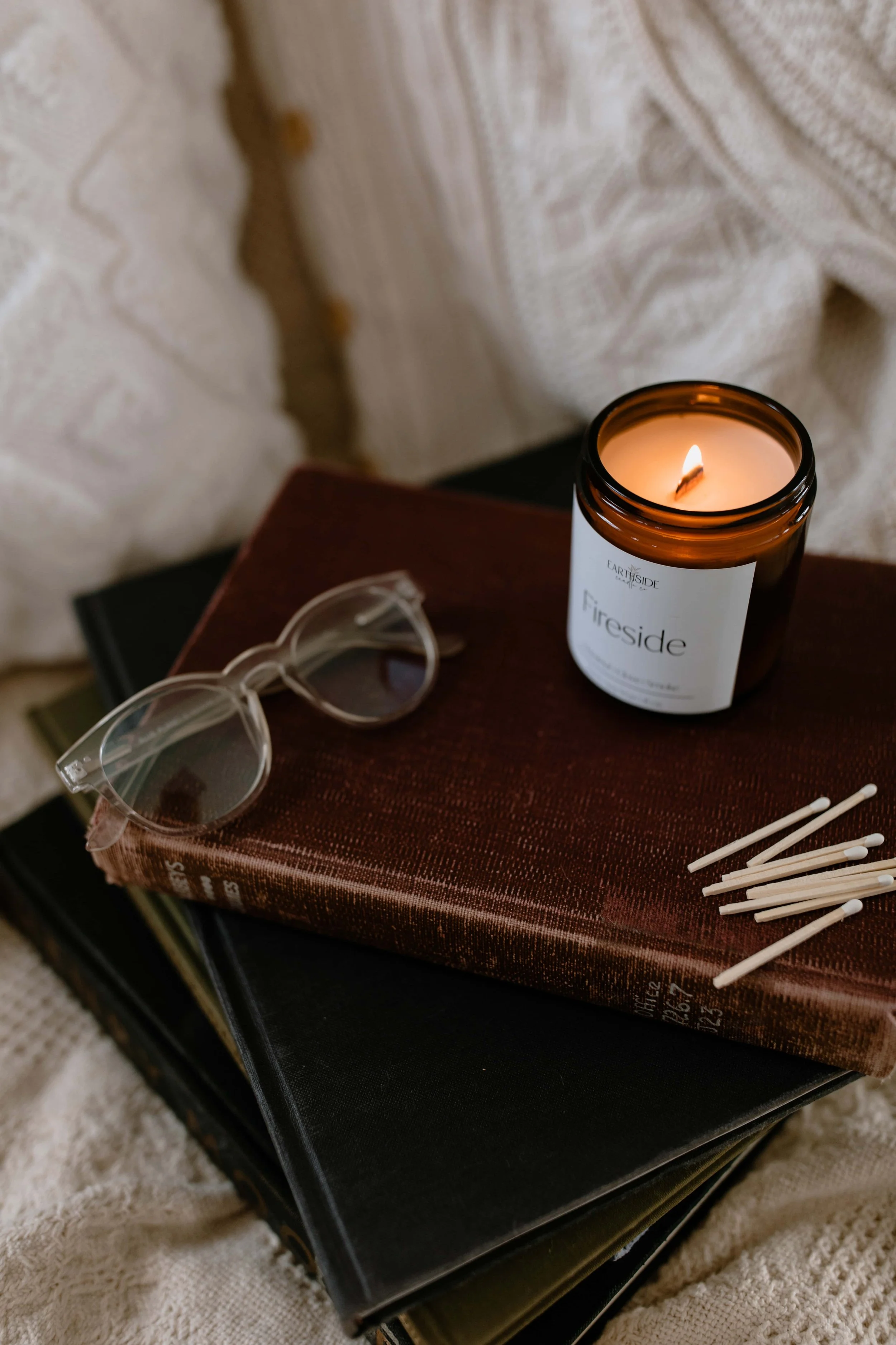 candle sitting on books