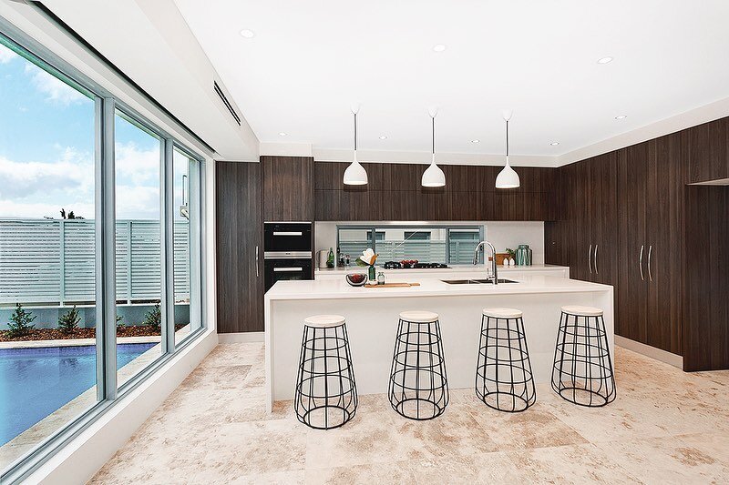A kitchen with a wow factor, fit for entertaining! Travertine floors tie together the old with the new and bring a delicious sense of prestige to our Forrestville residence. Swipe to see the open plan main entertaining room - with a frameless glass b