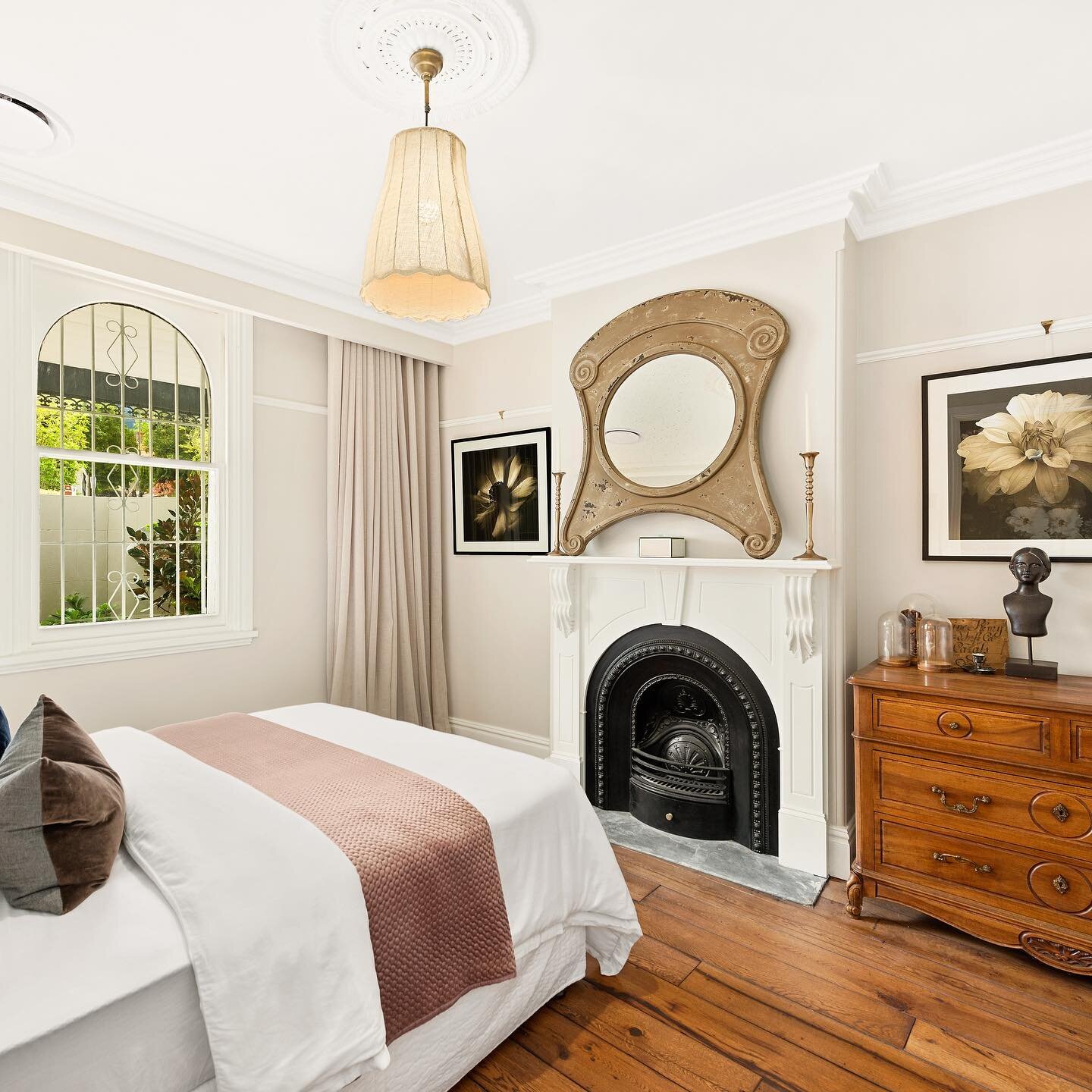 I&rsquo;d take this Guest bedroom as a main bedroom, would you agree! Recycled hardwood floors, restored original fire place and puddling curtains 😍 #recycledmaterials #recycledtimber #fireplace  #heritage #interiordesign #clienthasgoodtaste