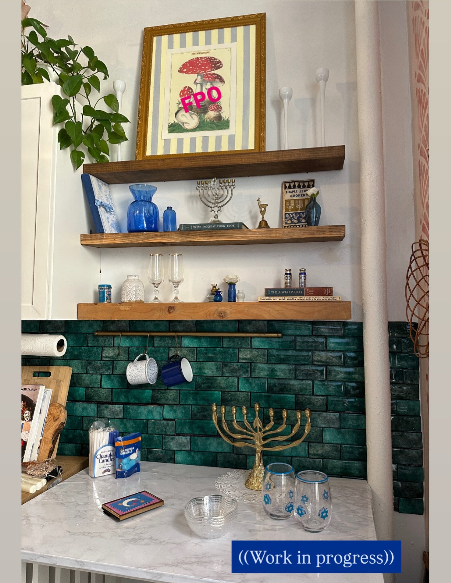 Here&rsquo;s a little WIP of my Hanukkah corner! 🕎💙 Having fun playing with vintage books and whimsical tchotchkes. Stay tuned for progress! Open to suggestions for the big frame, LOL. 

#hanukkah #hanukkahdecor #cozykitchen