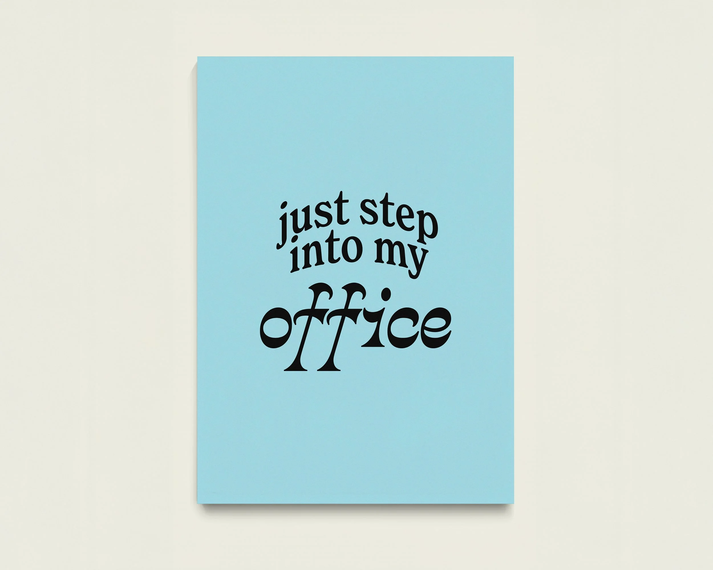 A blue piece of paper with the words "just step into my office" written in black text.