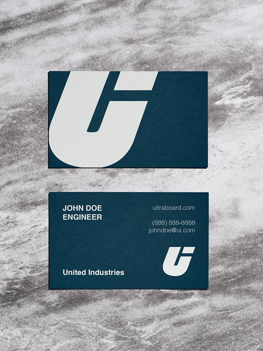 Business card for John Doe, engineer at United Industries, with a logo featuring a stylized 'U' and 'I', including contact information and website ultraboard.com.