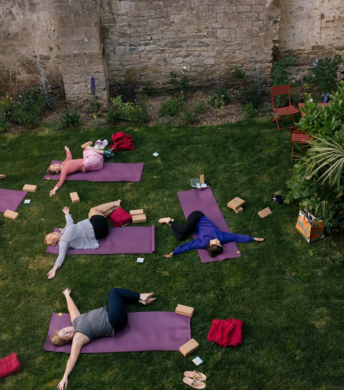 Yoga on a cloister lawn.