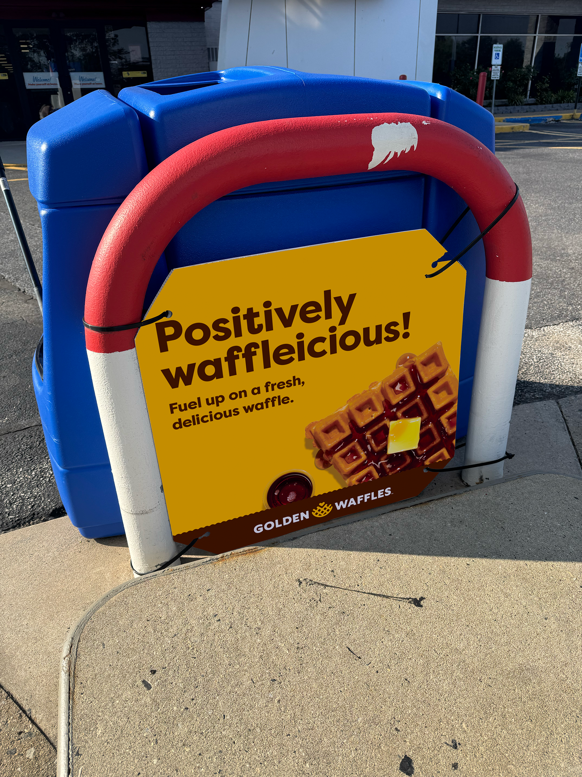 Signage by pump reinforcing our product in-store.