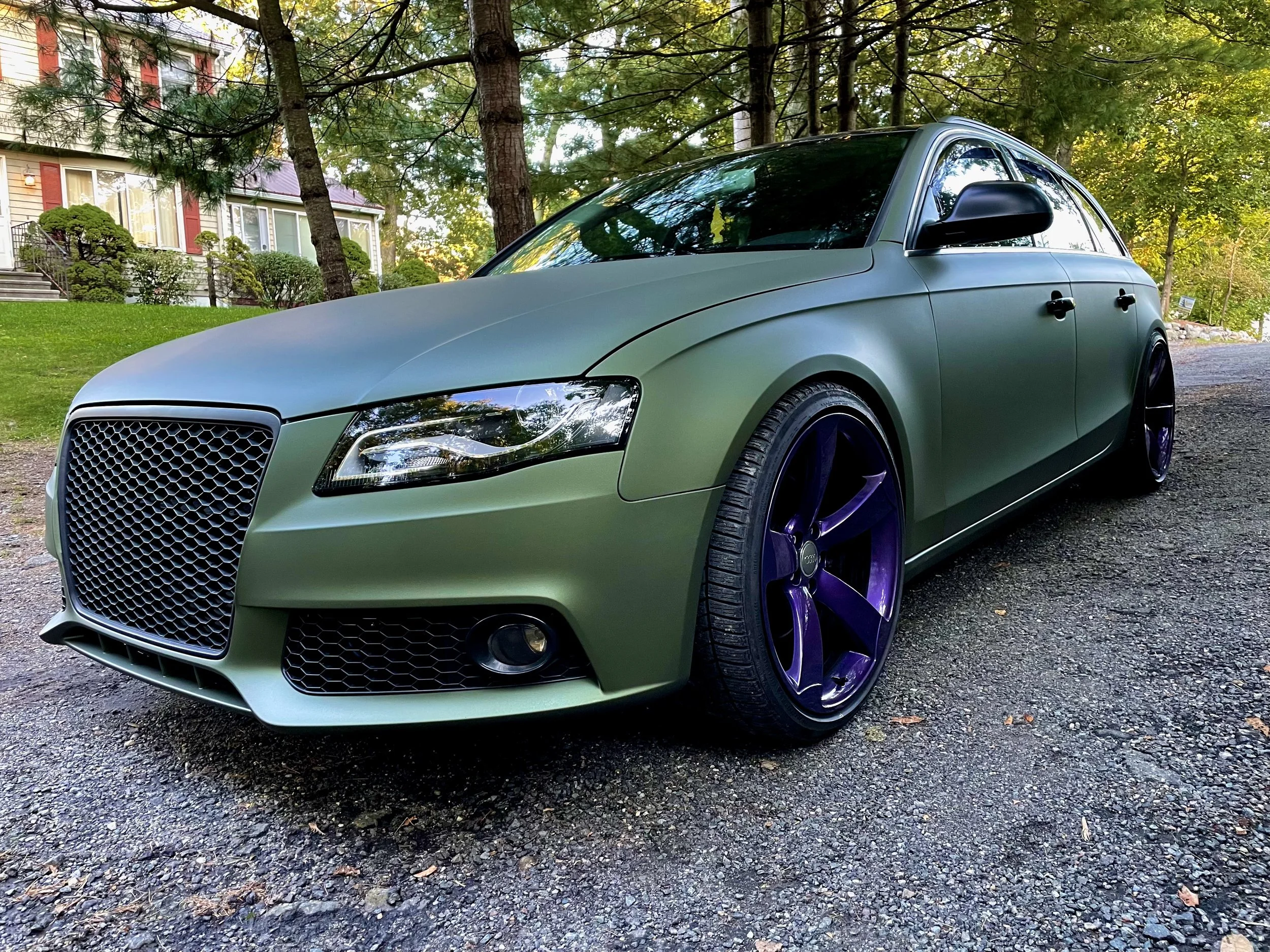vehicle liquid wrapped matte army green 
wheels custom purple 