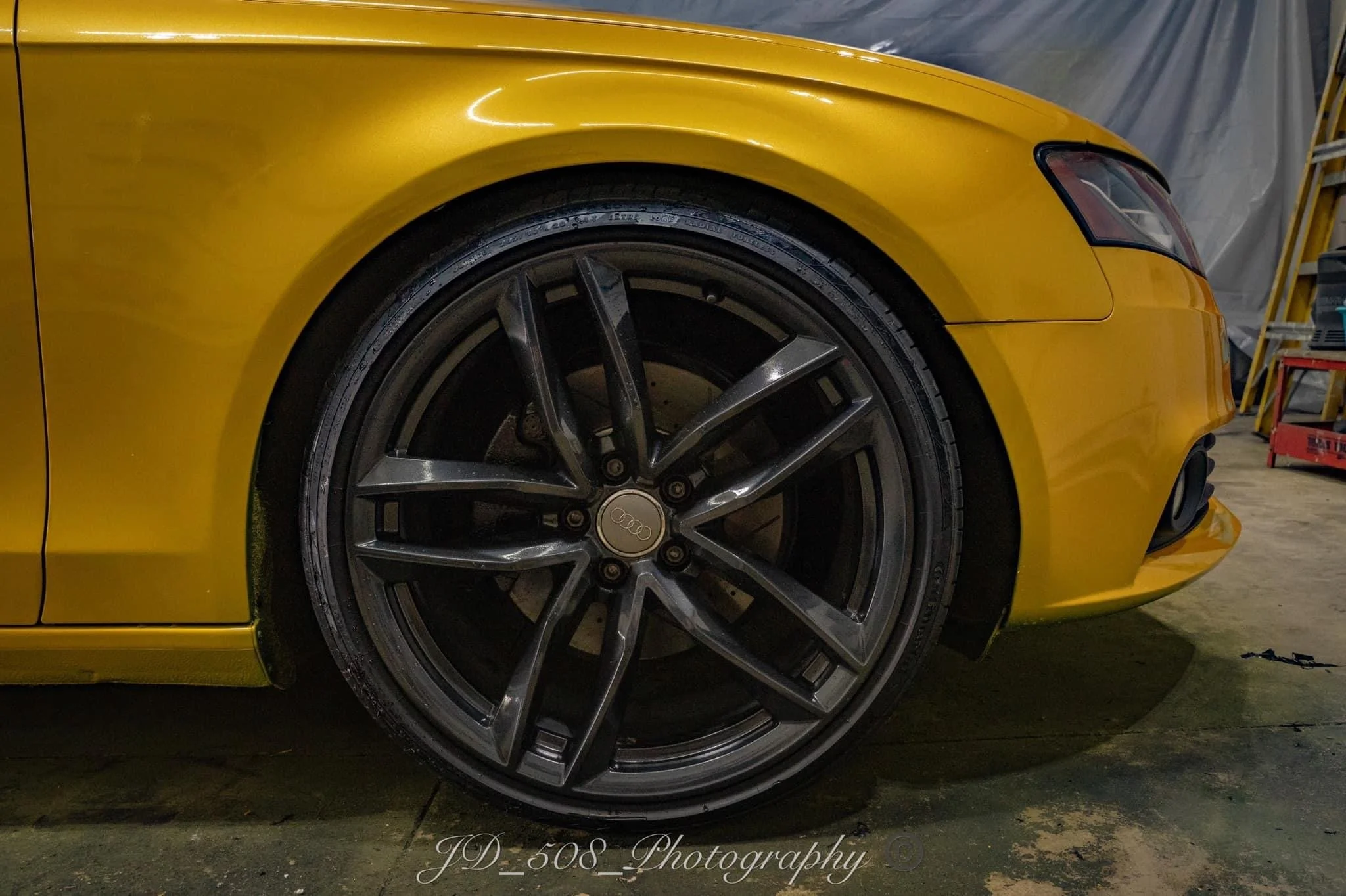 vehicle liquid wrapped custom yellow 
wheels storm cloud grey 