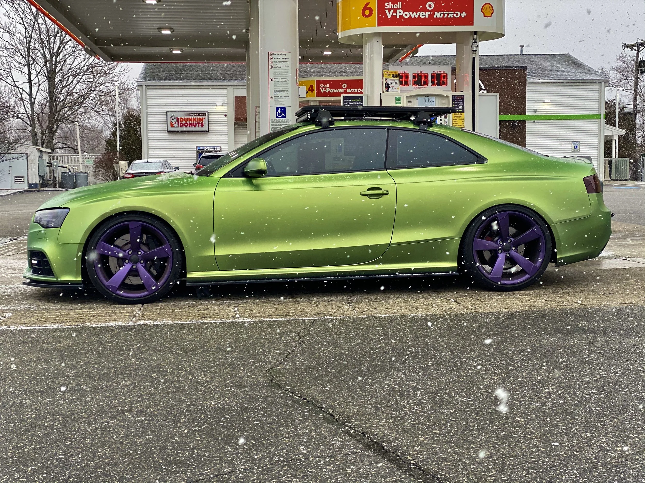 vehicle liquid wrapped custom green 
wheels custom purple 