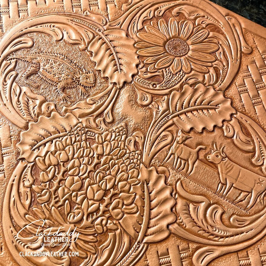 Pickin up where I left off🤘🤘#wip #flowervase #leathervase #leatherwork #leathercarving #hornytoads #cows #bluebonnets #daisies
