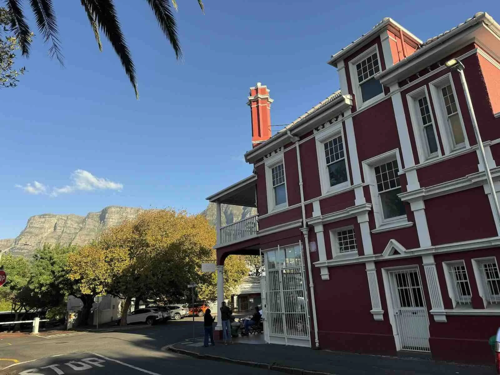 Crust bakery, the red iconic building on the corner of Duke and Station road in Rondebosch