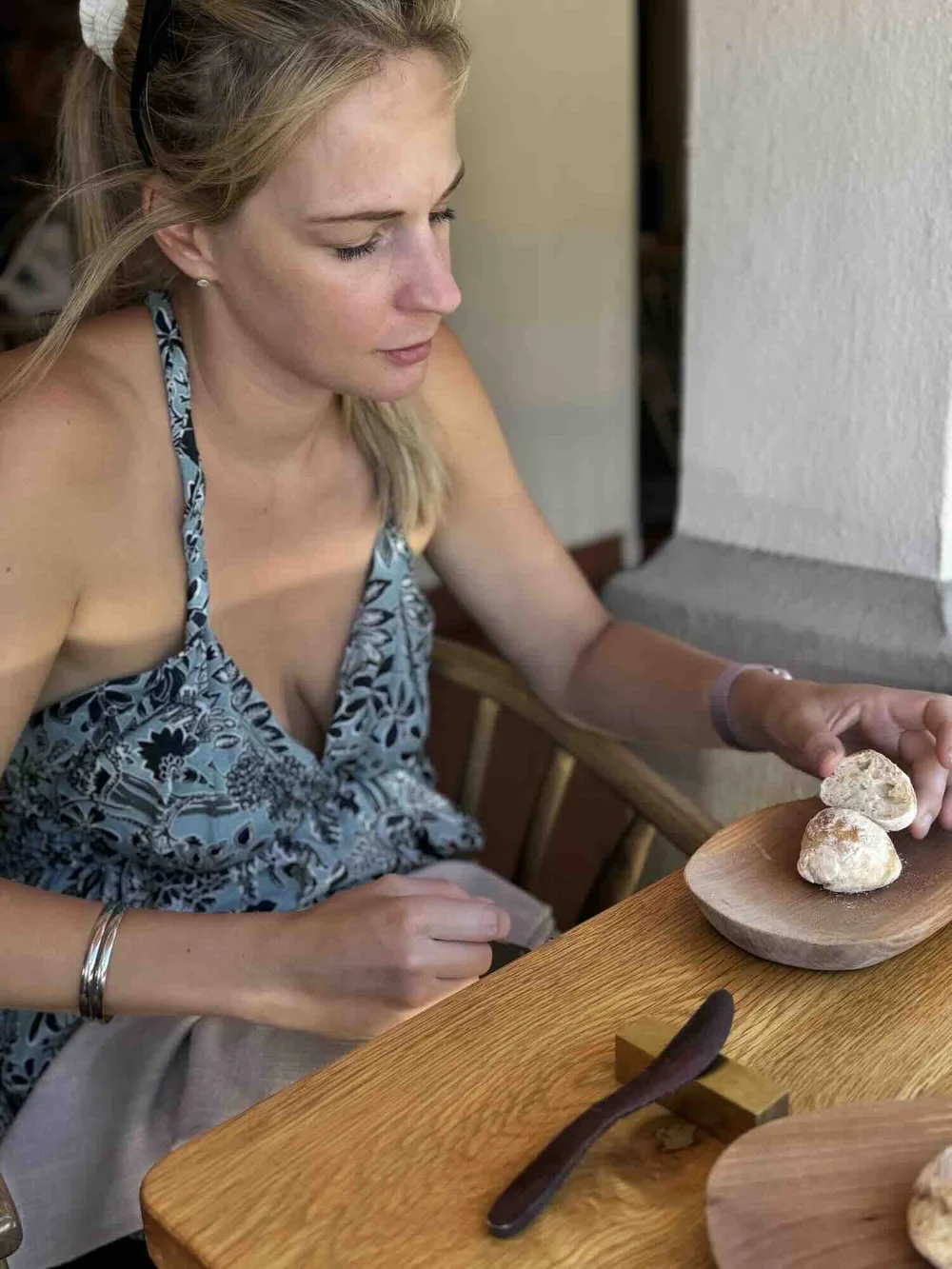 Lianne eating the ciabatta starter Eleven Restaurant Franschhoek.jpeg