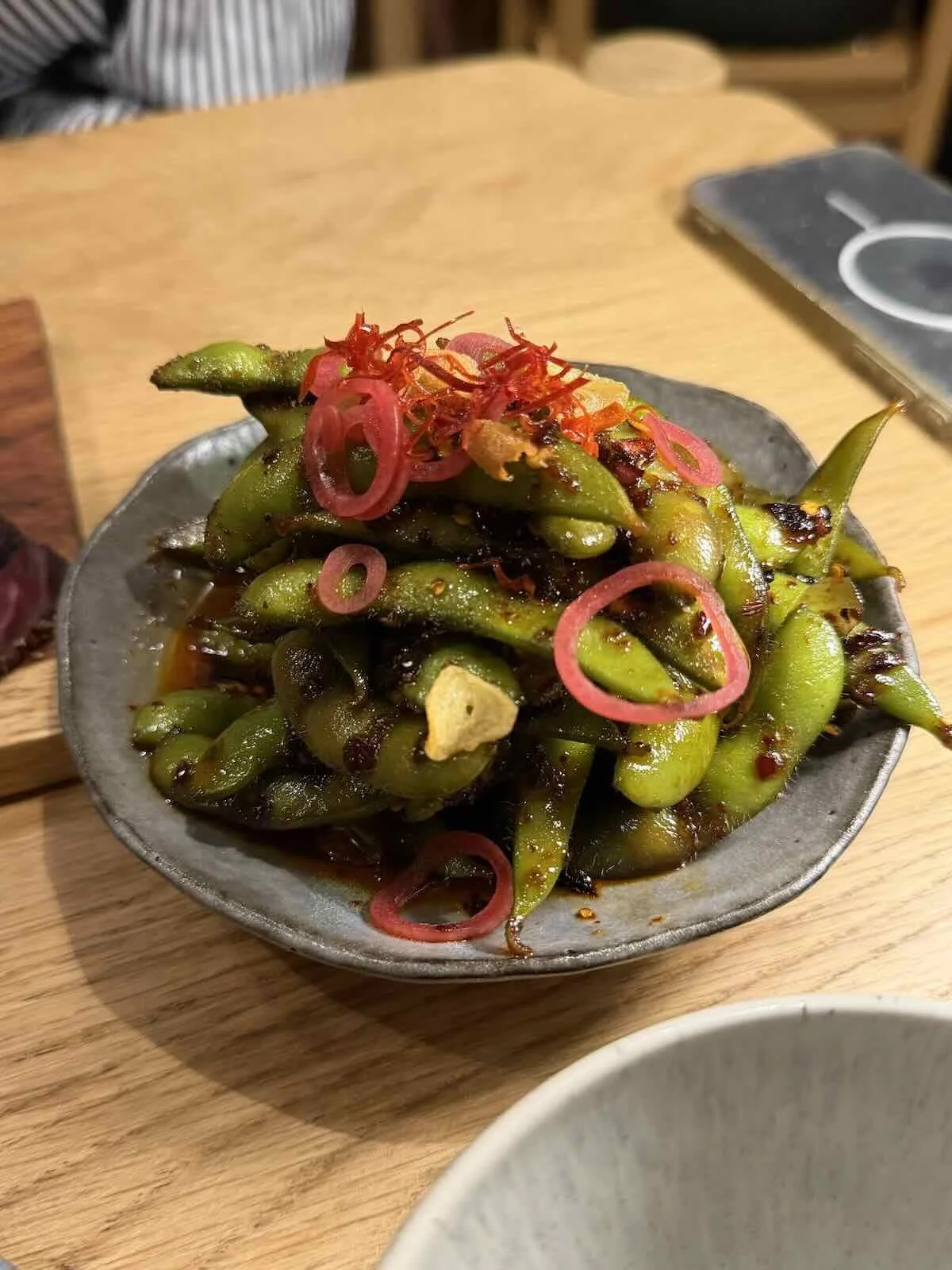 Edamame with chilli crisp, ginger, soy