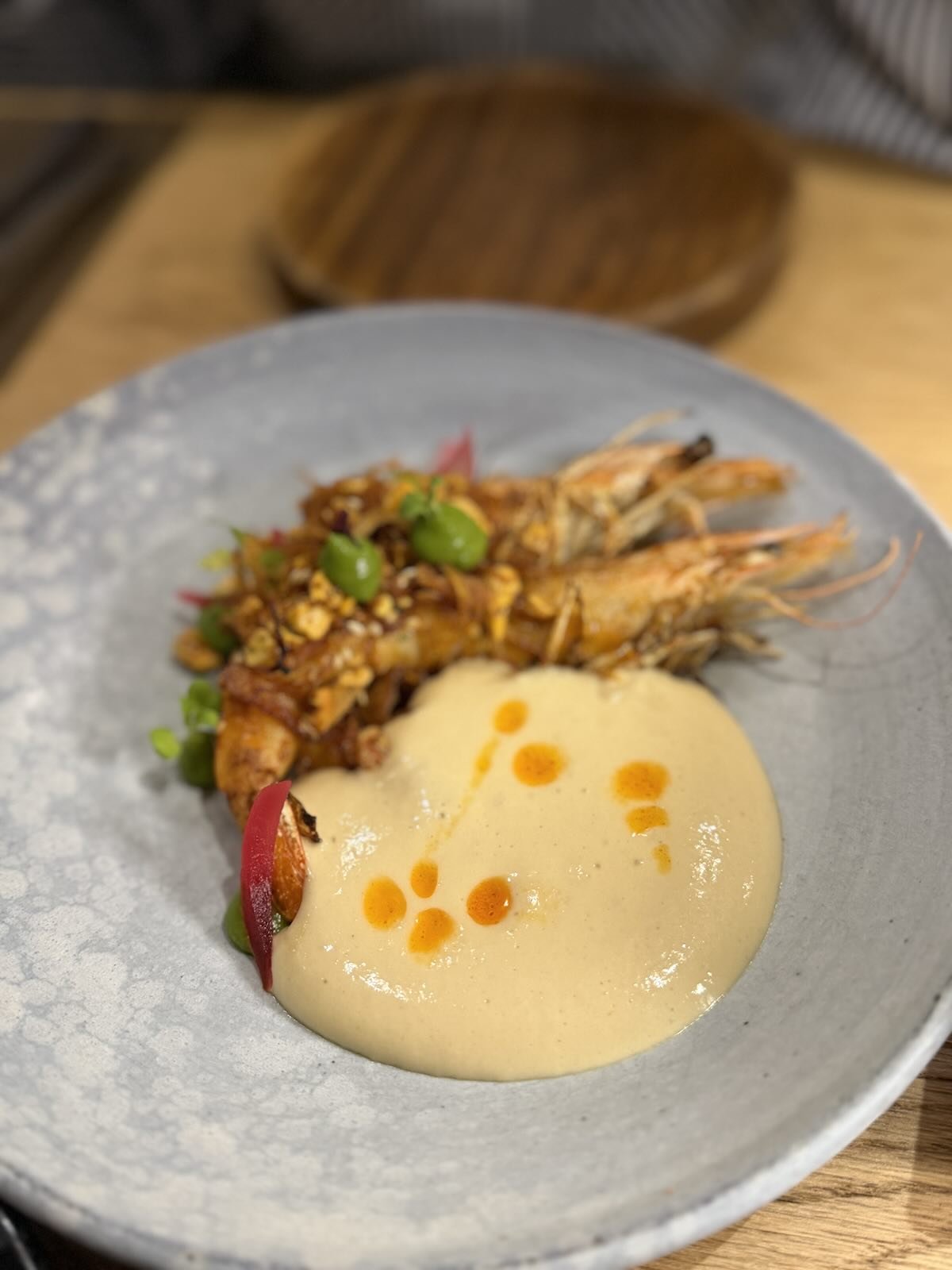 Coal-Fired Prawns with Peri-peri, cashew crumb, smoked garlic and a charred salsa verde - delicious.
