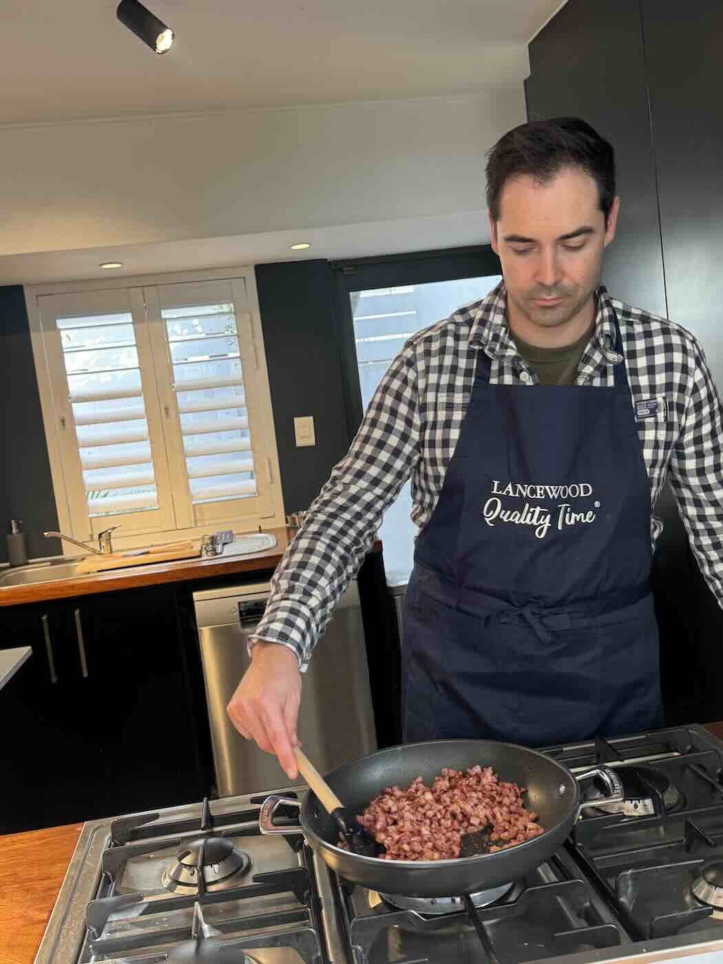 Shawn frying up bacon bits
