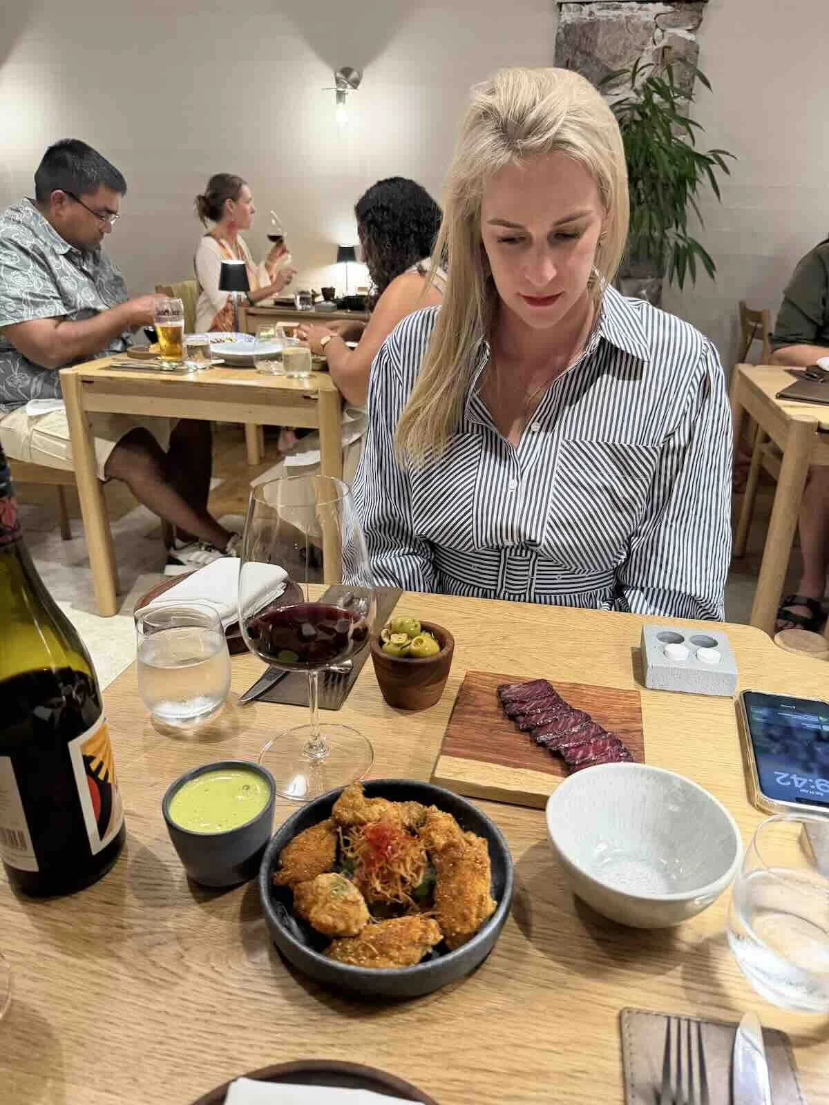 My wife, Lianne Godfrey at Little Fox - our starters had just arrived (wagyu biltong, olives, zab-zab chicken wings with coconut espuma