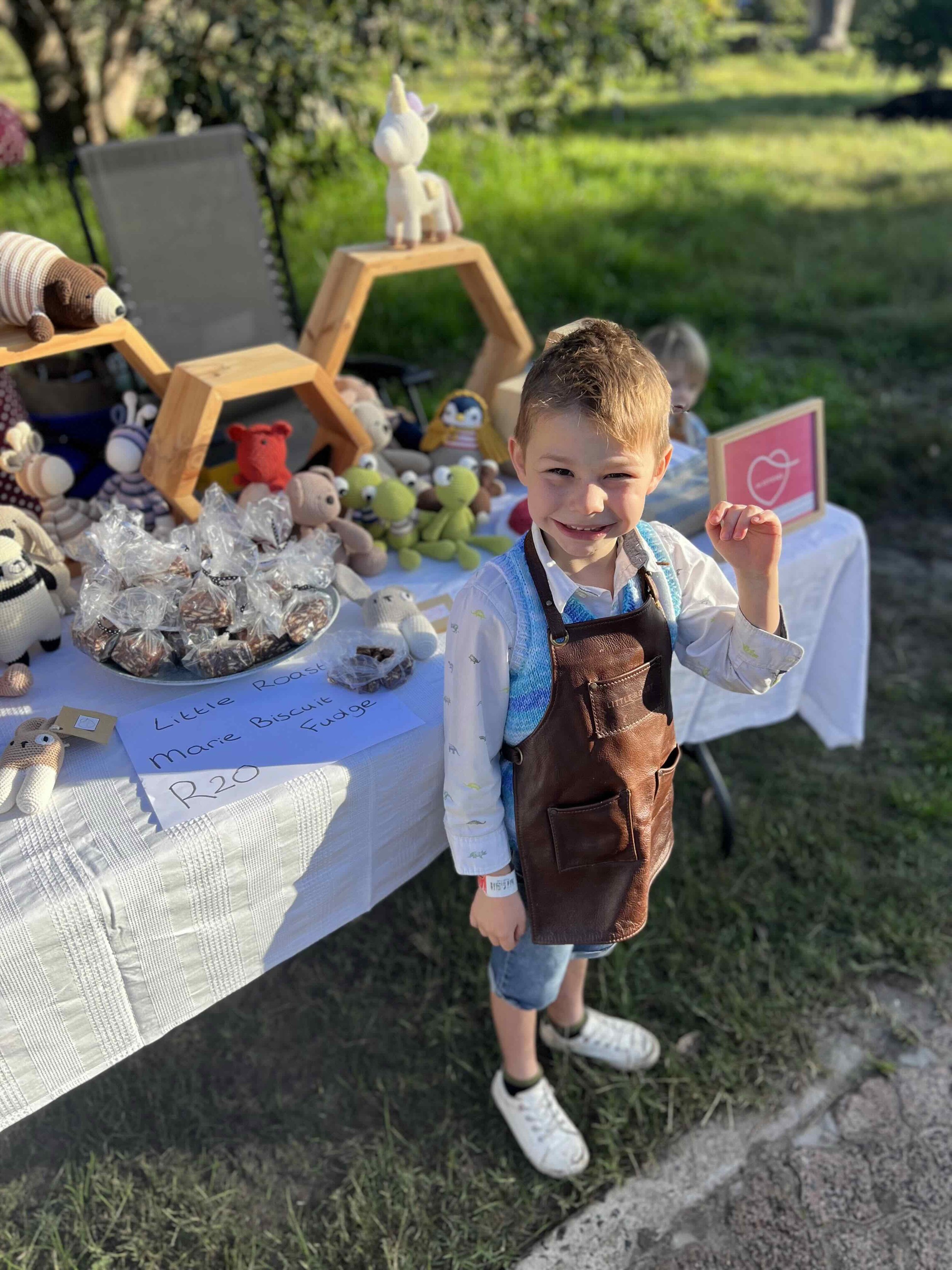 Aiden in front of his market stall 2:3.jpeg