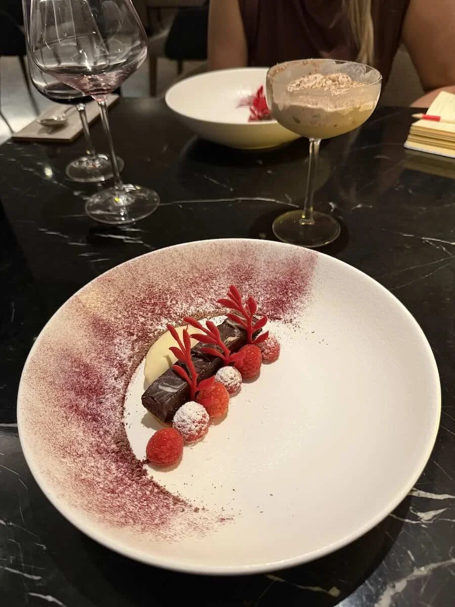 peppermint crisp, Amarula, Milo foam, millionaires shortbread, and fresh raspberries