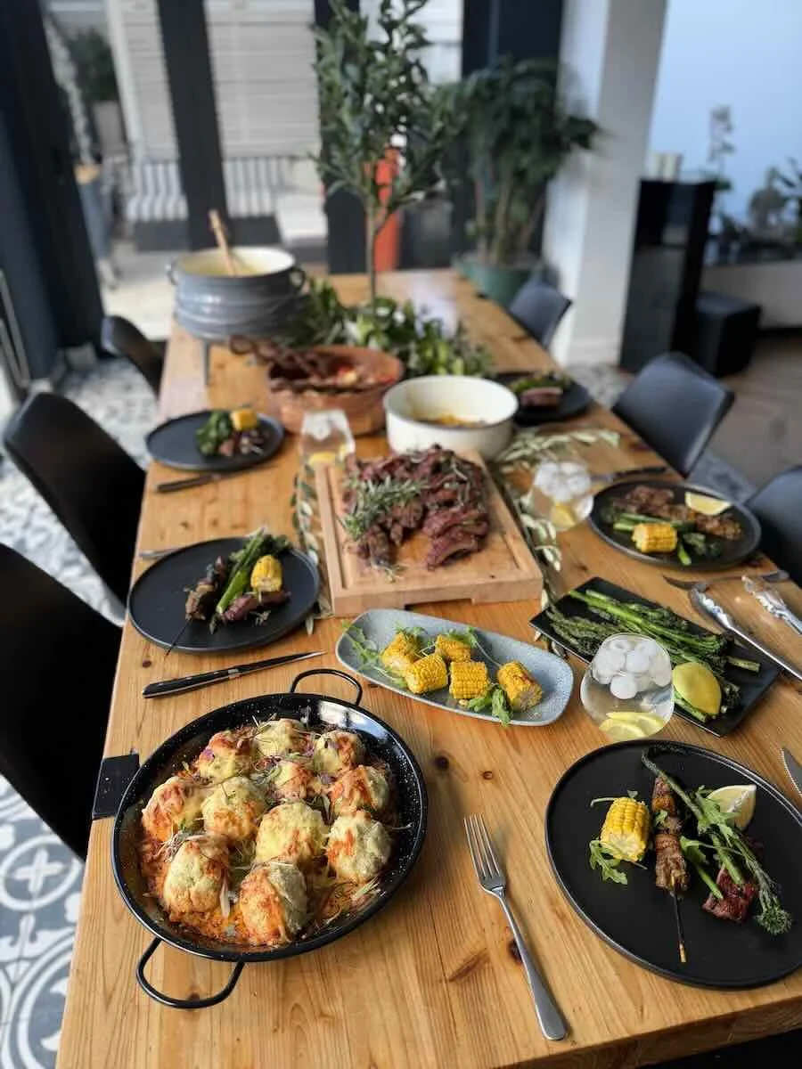 South African pap arancini served with braai ribs. asperges and mielies