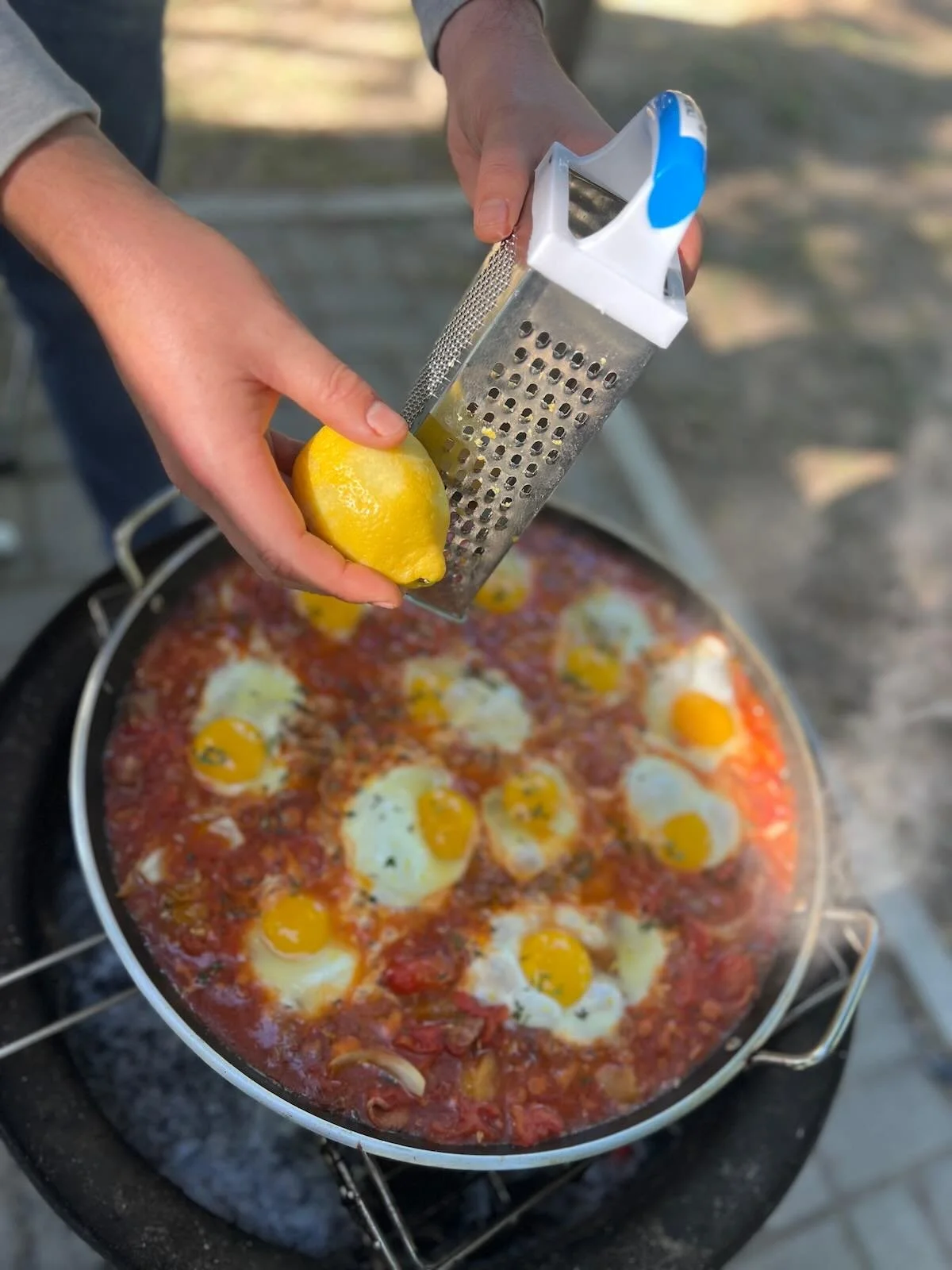 Boerewors shakshuka - grating lemon peel 2.jpeg