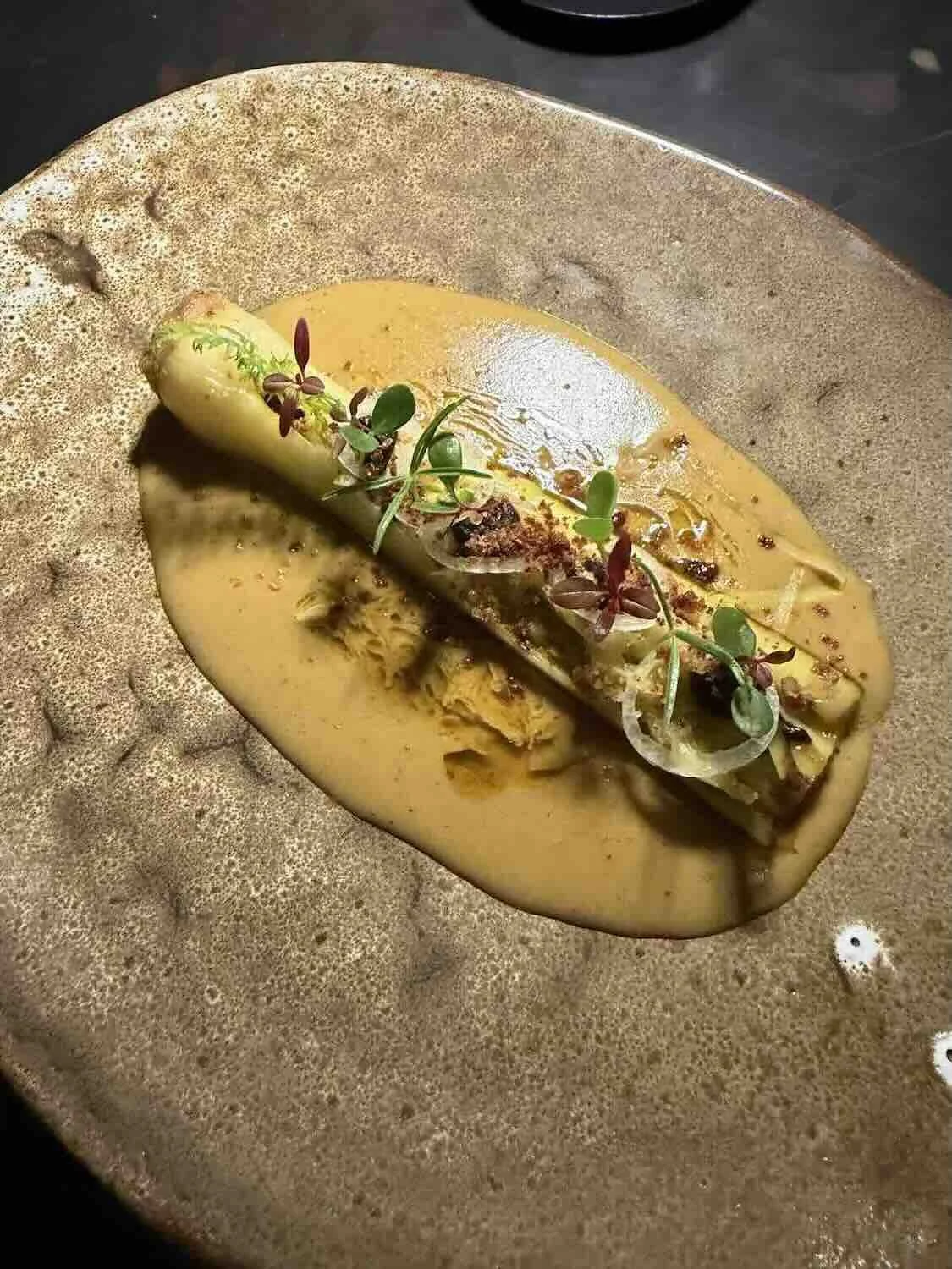 Terrarium restaurant menu Charred leek, Textures of onion, Vadouvan, Turmeric