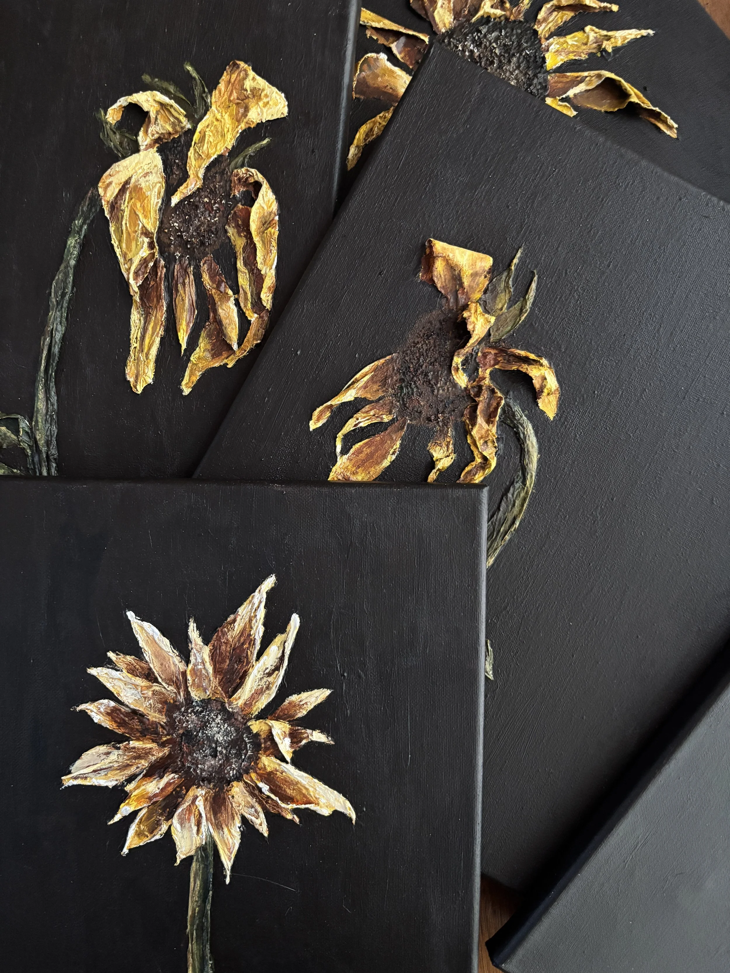 textured sunflower painting on black background, mixed media floral artwork