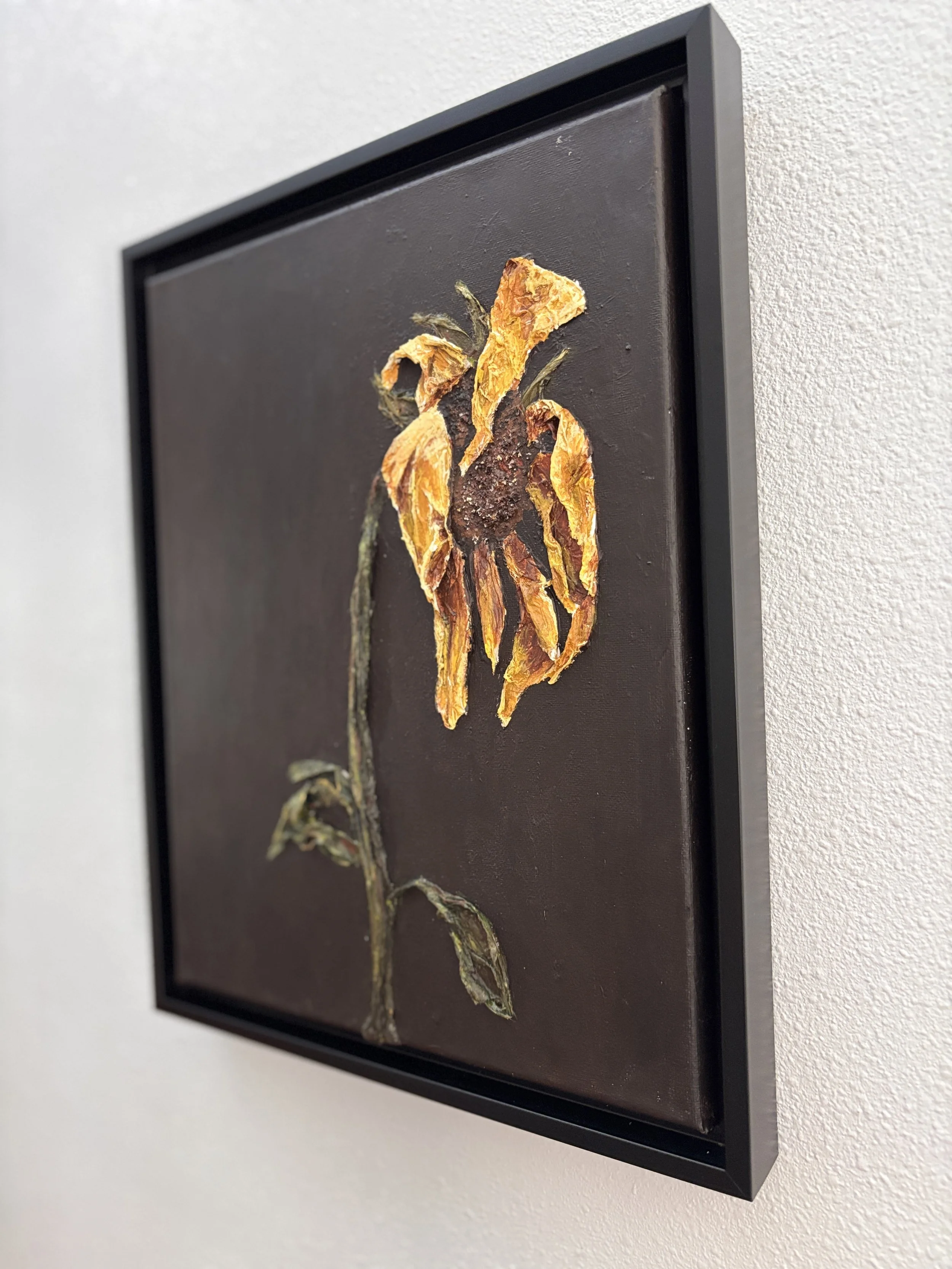 textured sunflower painting on black background, mixed media floral artwork