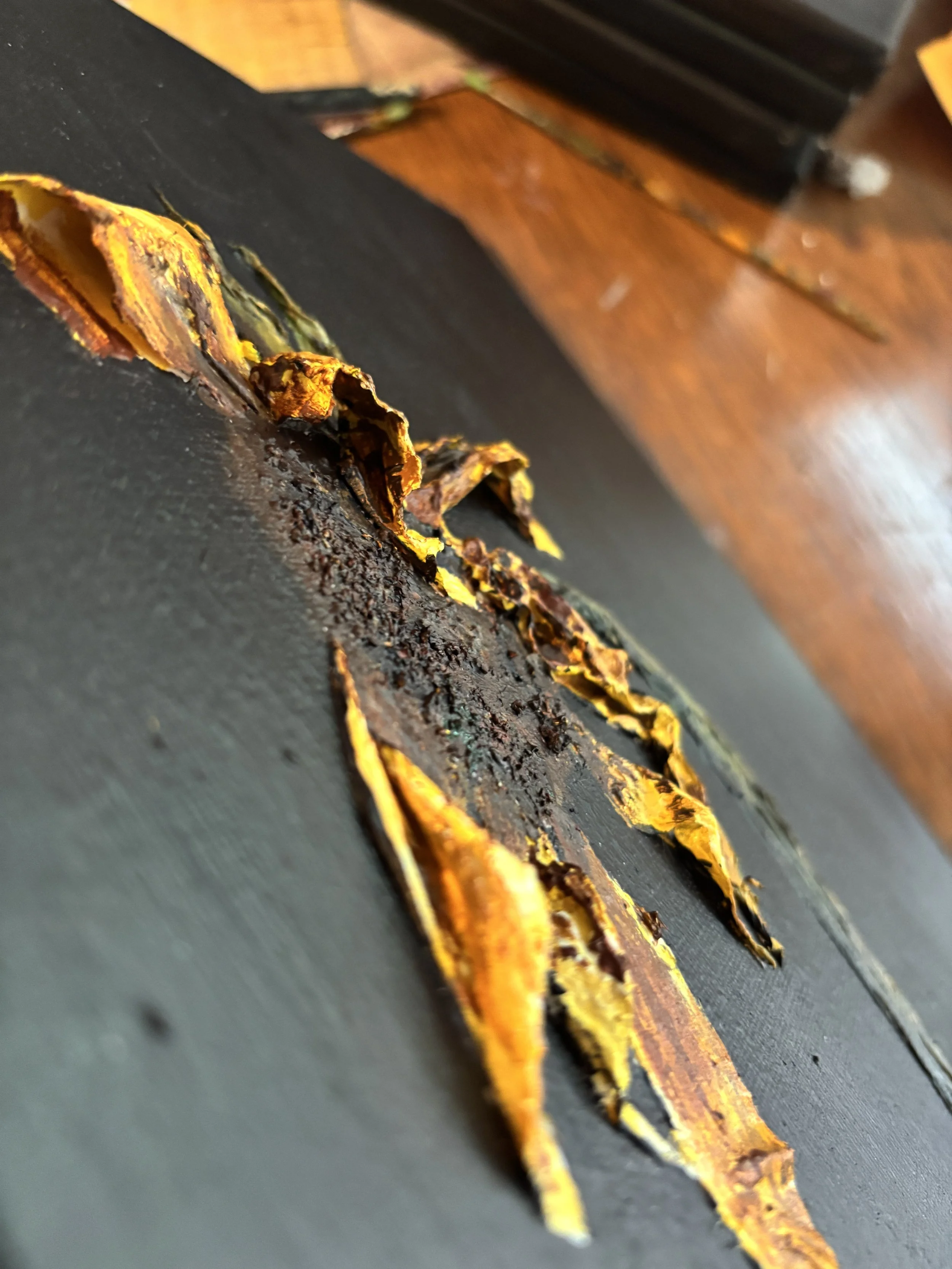 close up of layered paper petals in sunflower painting, textured mixed media art