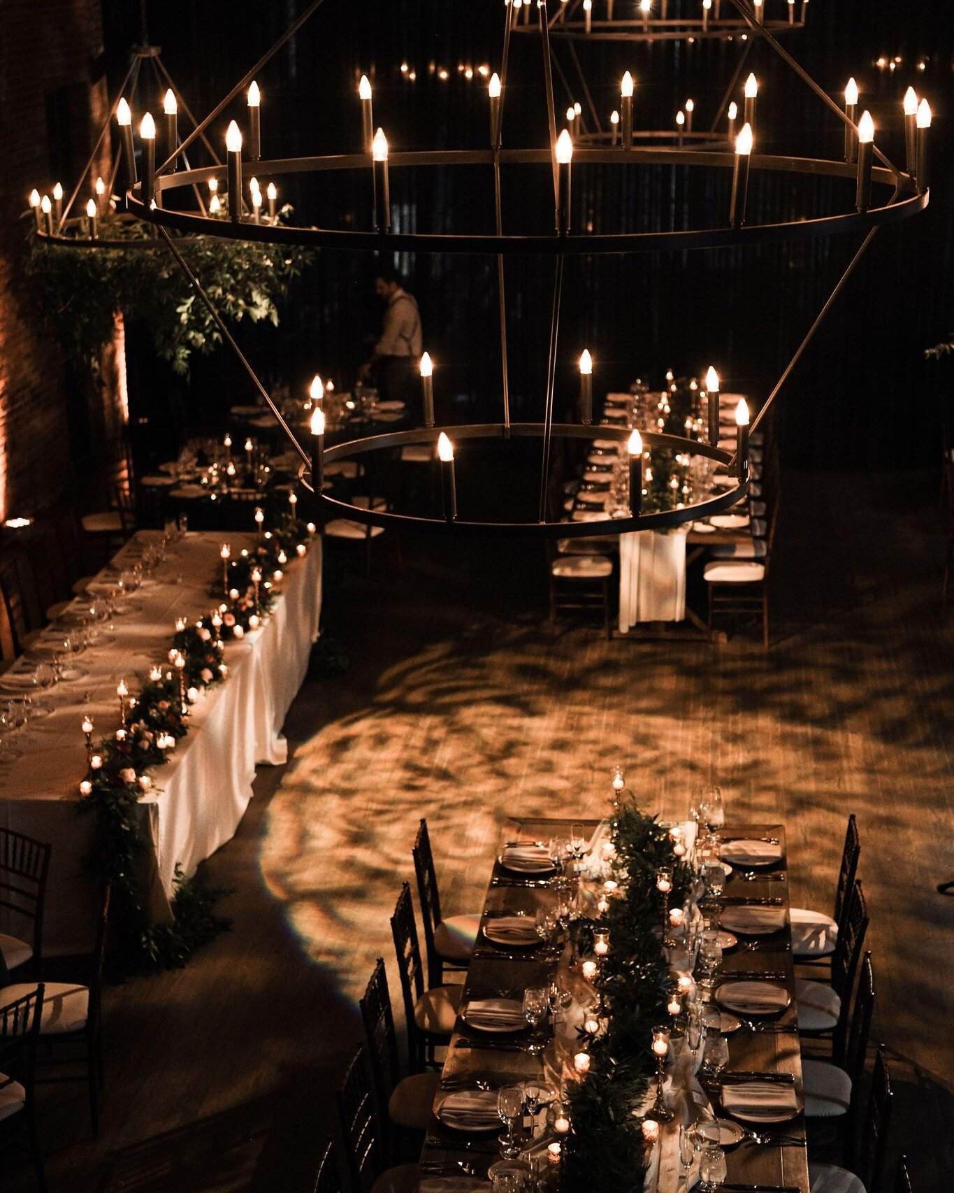 Uplighting + exposed brick = your new fav combo 😍😍😍

Photography: @photo243_ 
Florals: @orchardlaneflowers 

Image descriptions:
Image one: This photo overlooks the main hall of High Line Car House. There is a wedding reception set up with no peop