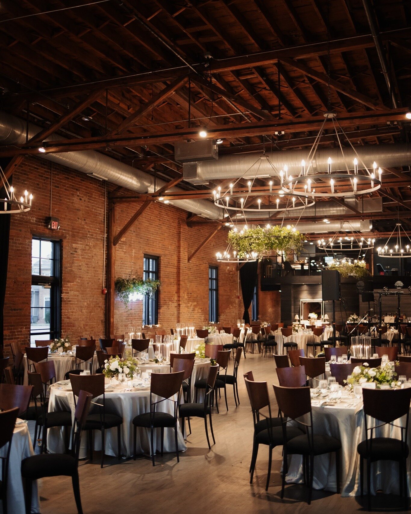 Moody details from a gorgeous day 💙🥰 

Photography: @coleyandco 
Planning/decor: @aisleandco 
Florals: @petalsandleavesflorist 

Image descriptions:
Image one: A wedding reception in High Line Car House. The exposed brick walls, industrial ceiling 