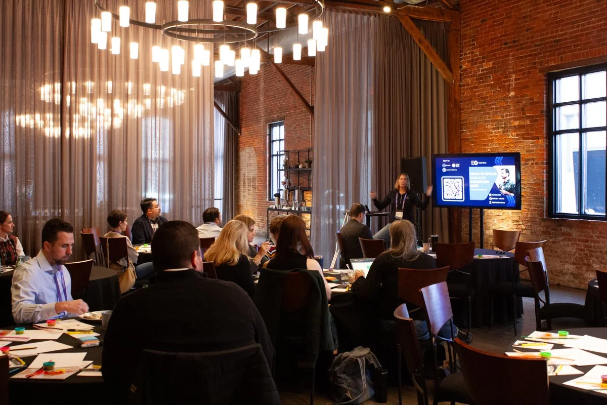 Someone kicks off a business presentation in a historic industrial event space in German Village, Columbus, Ohio.