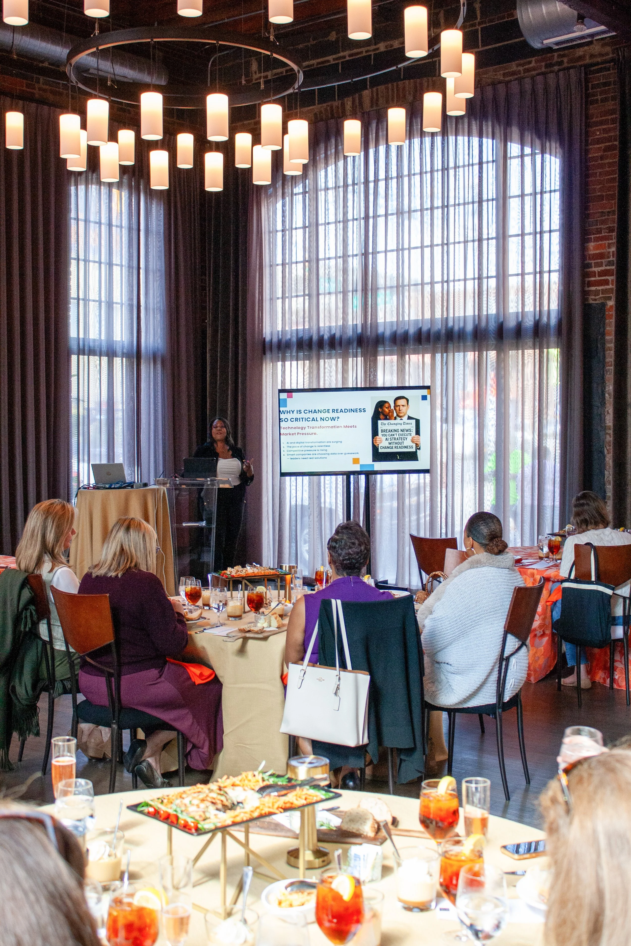 Someone gives a presentation during a lunch and learn in a historic event venue in German Village, Columbus, Ohio. 