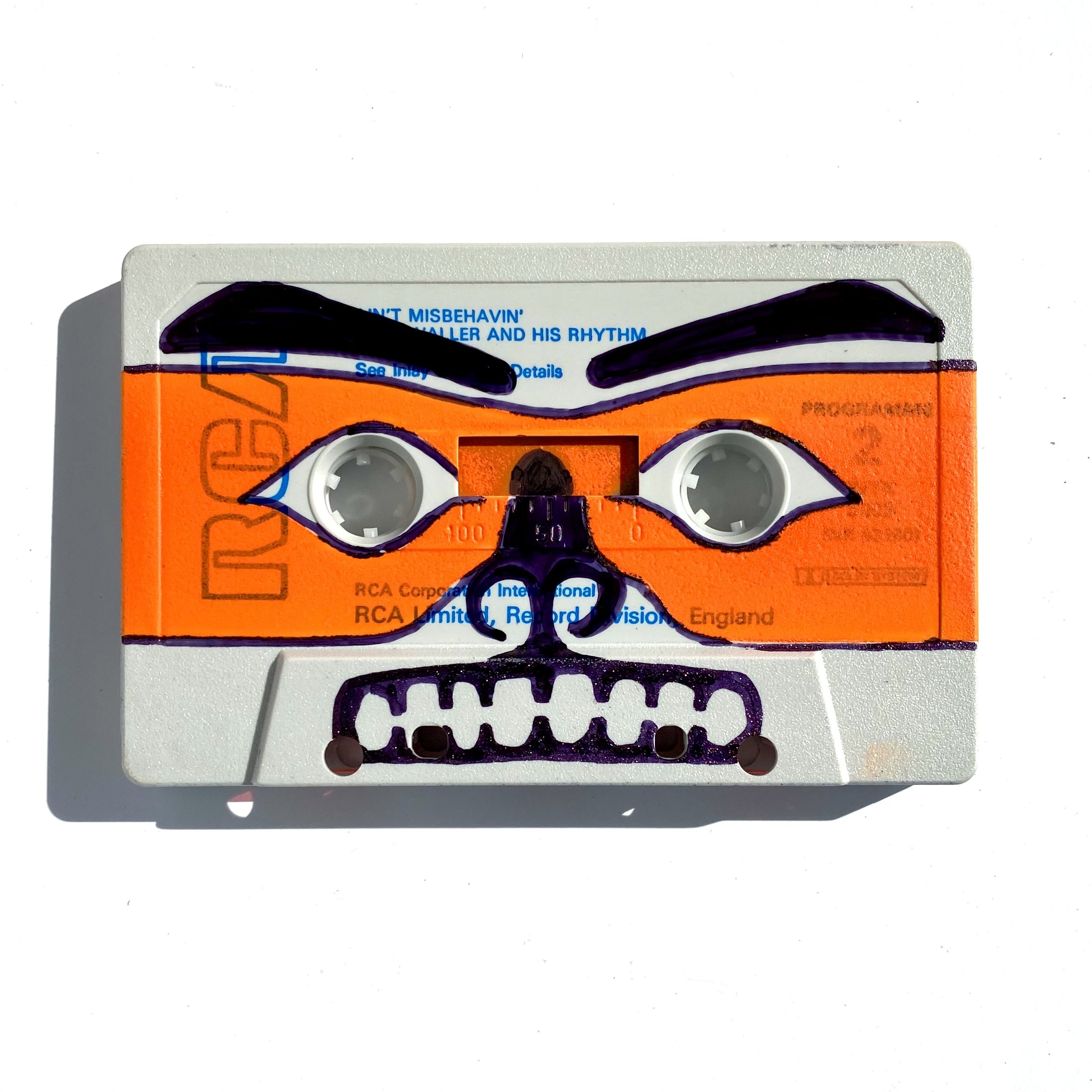 Insecure Mixtape. Romance Story. 1. Saving My Love for You (Your Kisses Are//Warm//Fuzzy//Warm//Fuzzy//)
Spray paint, sharpie on cassette tape 
2 1/2”x4”x1/2” 