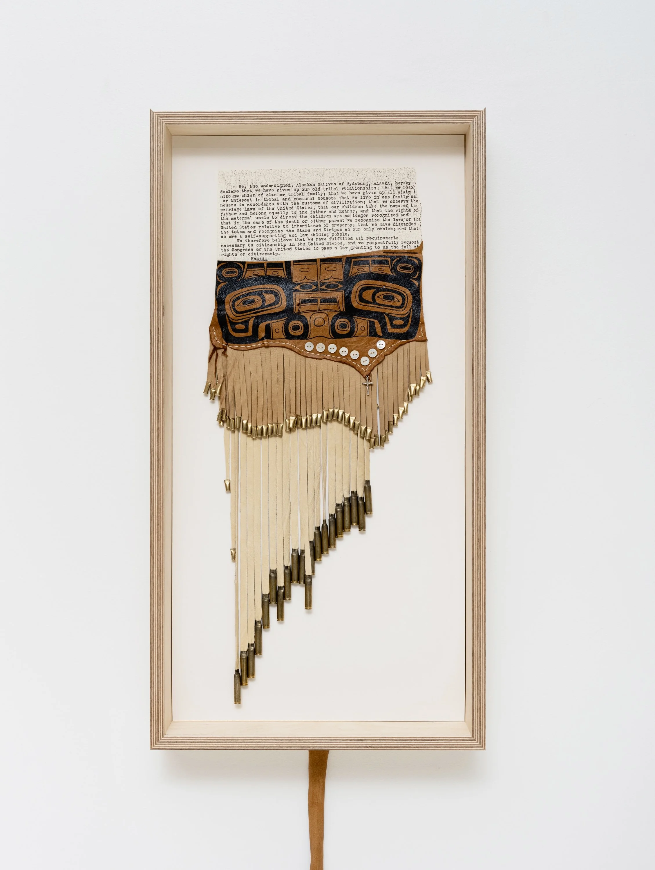 Kán gigáa / dance apron. Never Your Subject (White Lies with Our Skin in Your Game), 2025

archival copy of the Hydaburg Agreement, scrap deer leather, paint, mother of pearl buttons, .22 brass, .223 brass, pendant crucifix
31.25 x 16.25 inches