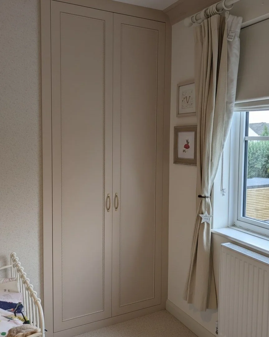 A bespoke fitted wardrobe for a young girl's bedroom in Cirencester. 

Internals all oak veneer ply, with brass hardware (drawer pulls in the post...), doors featuring a rope moulding we've not done before and finished in Coat paint's &quot;Pudding&q