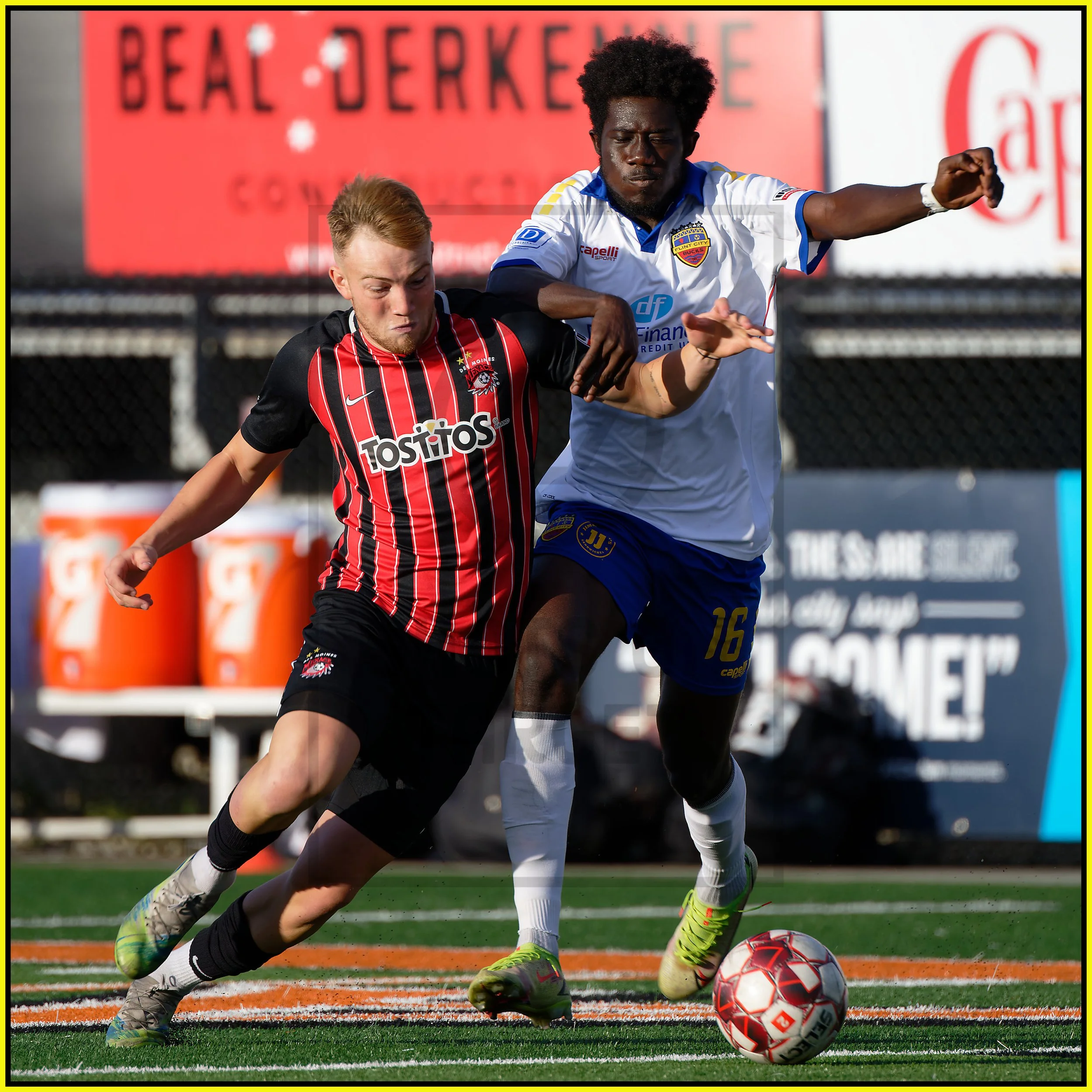 Des Moines #8 Eliot Goldthorp tries to get around Flint #16 Eugene Quaynor