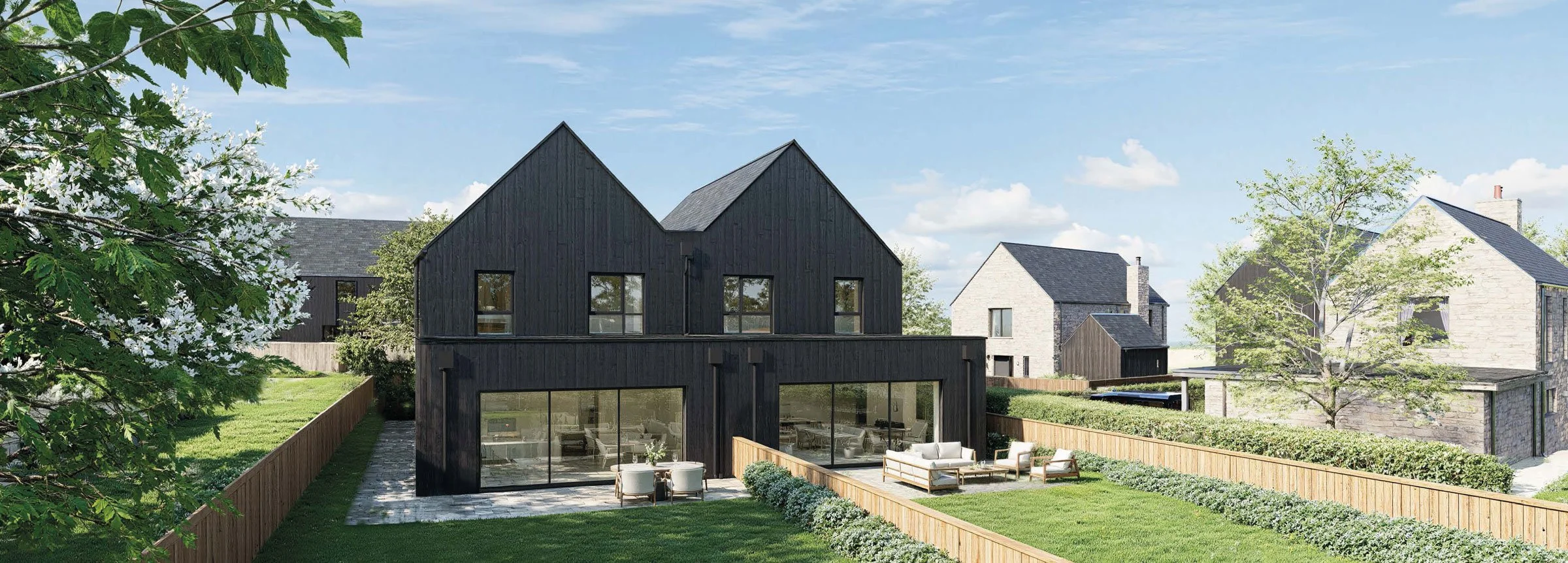 Modern black two-story house with large glass windows, surrounded by green lawn, trees, and neighboring houses under a partly cloudy sky.