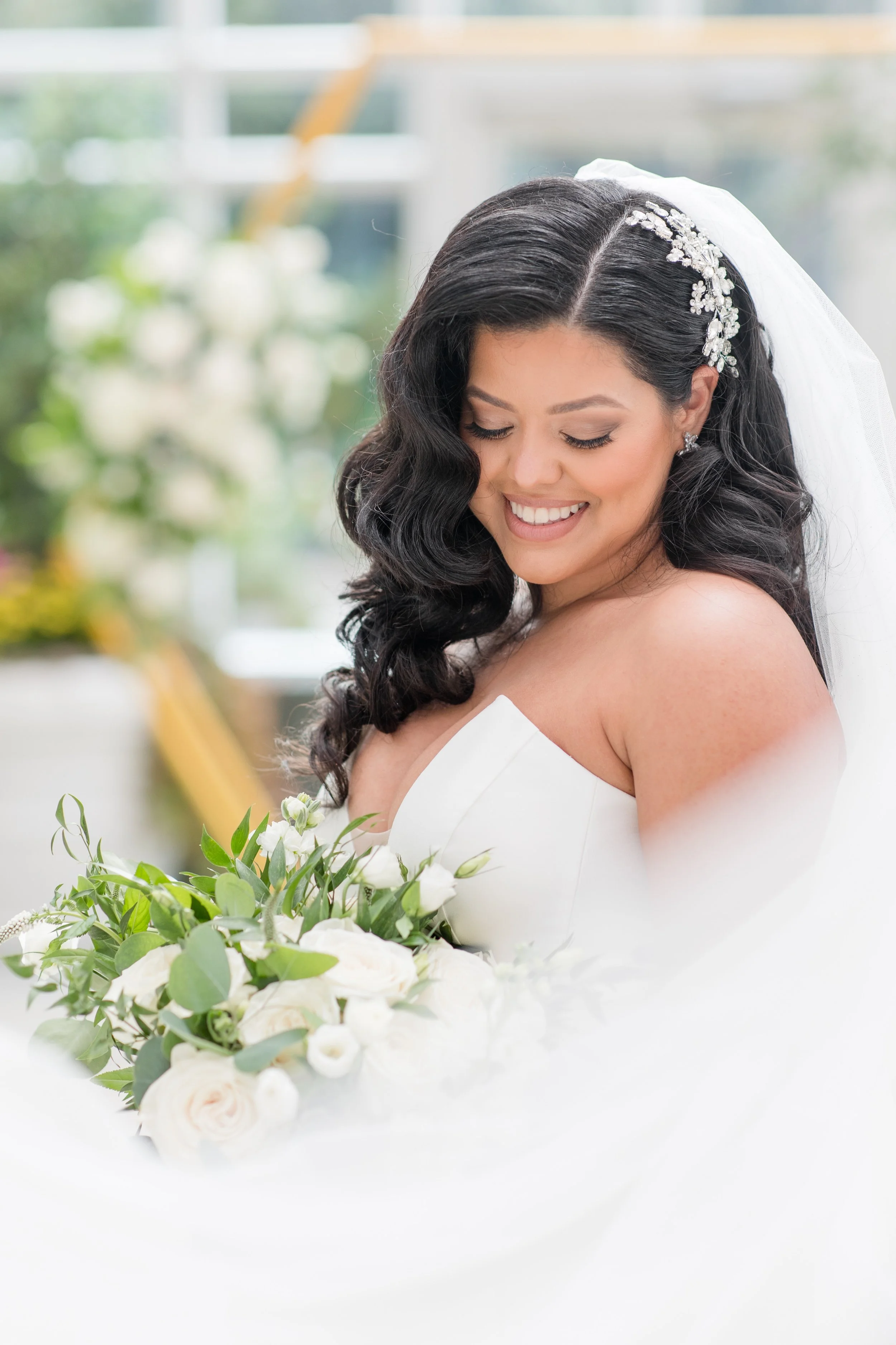 Veil framing bride with bouquet in wedding photo by Jessica Anne Photography