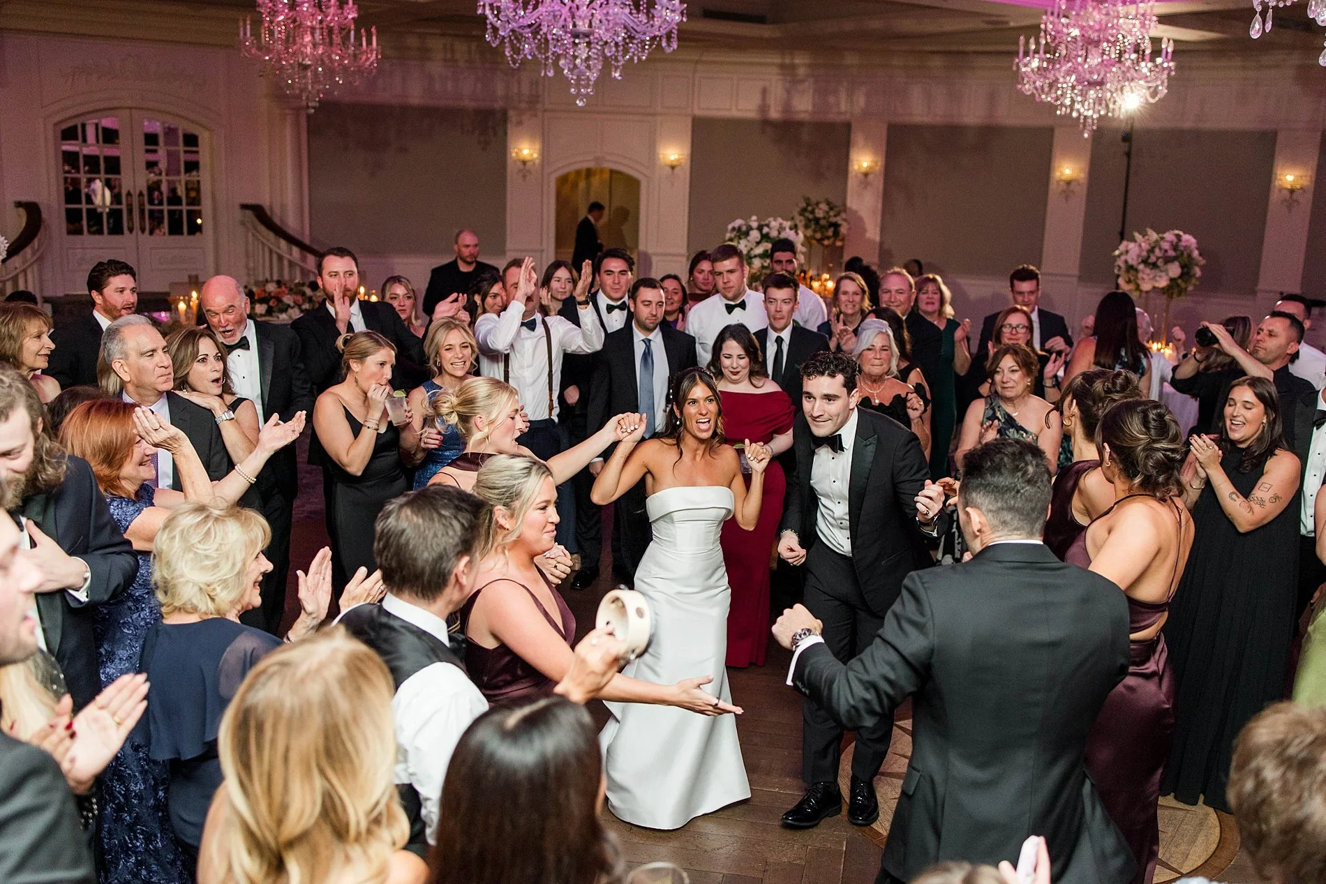  wedding guests celebrate newlyweds on dance floor at Clarks Landing wedding 
