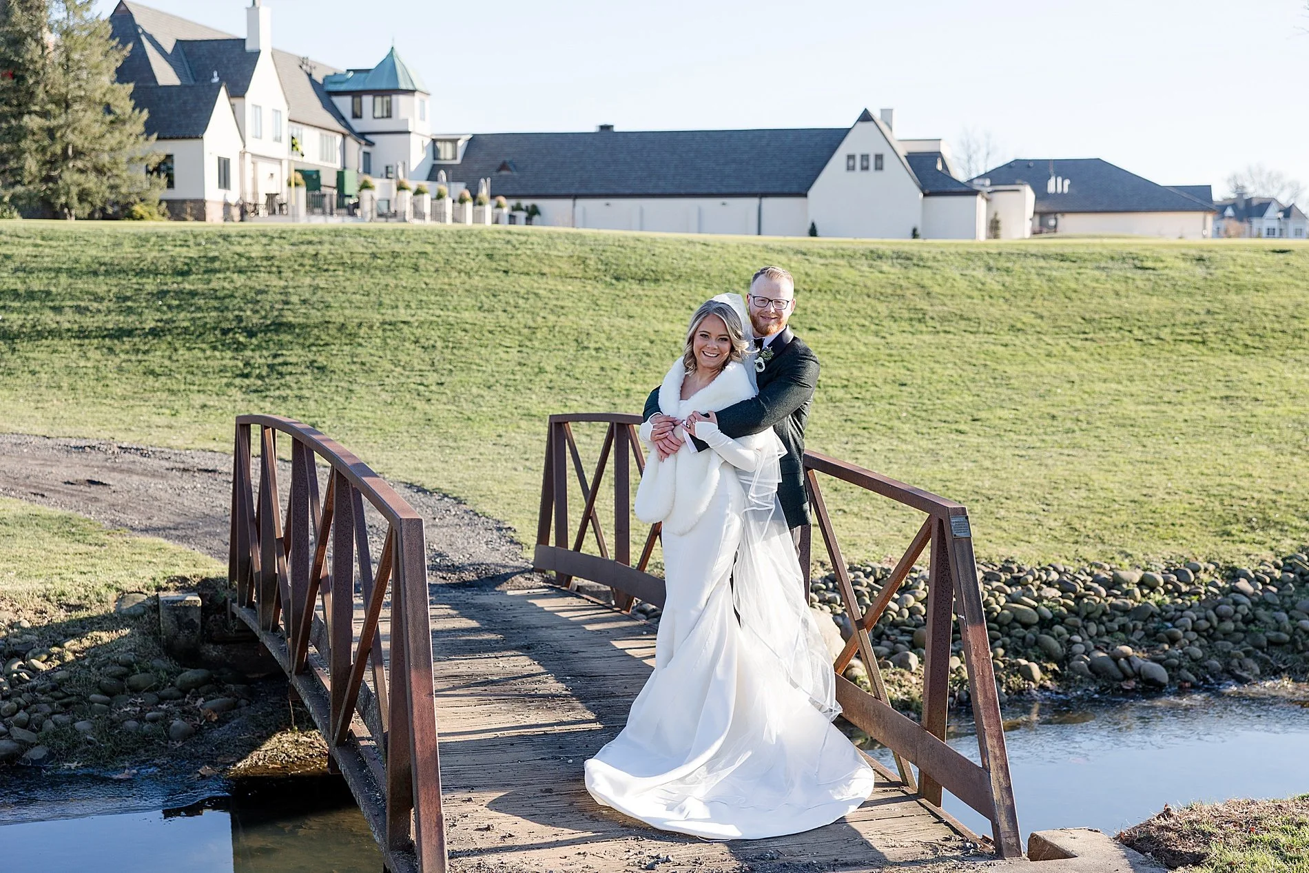  bride and groom photos on a bridge over water  