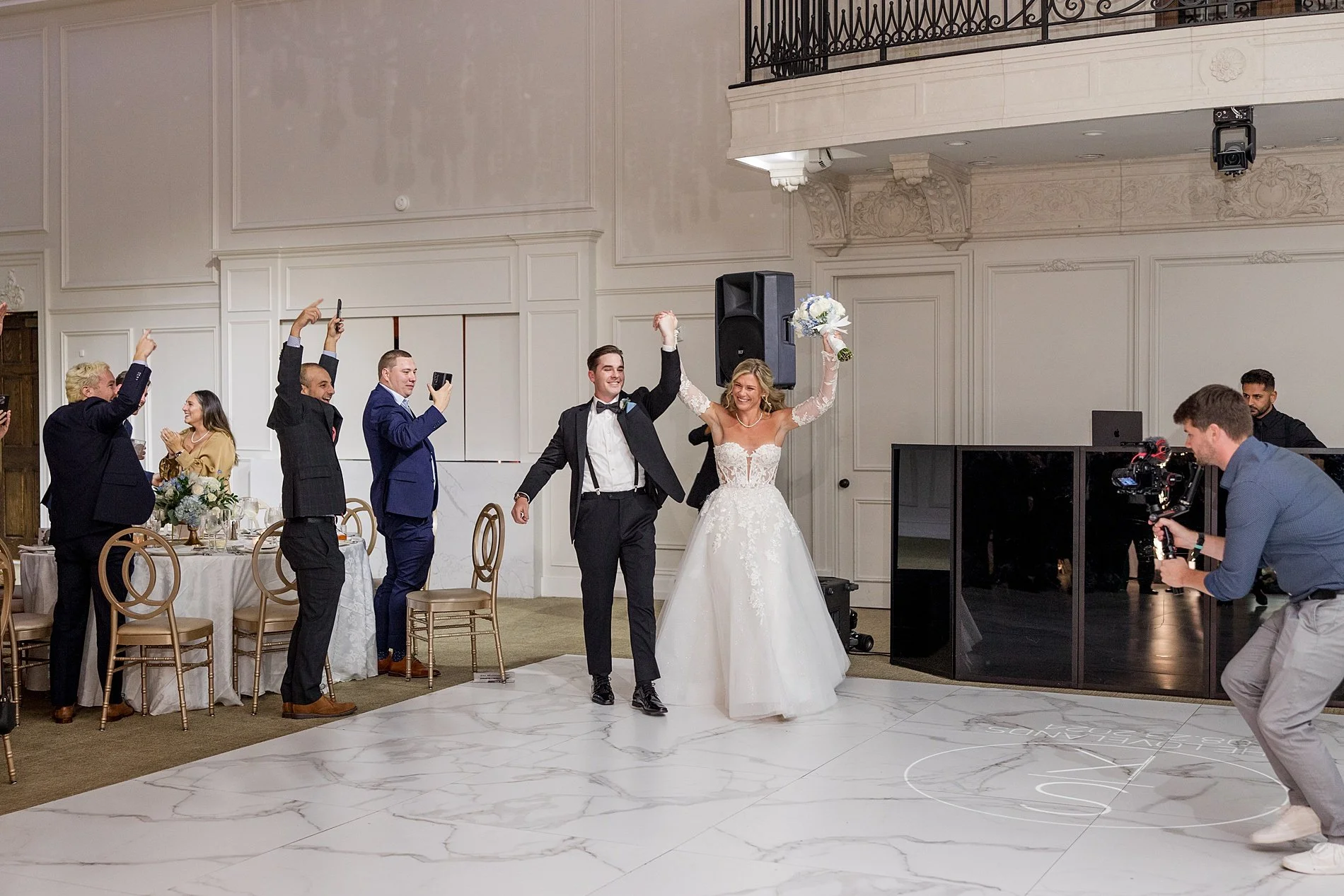  newlyweds enter wedding reception  