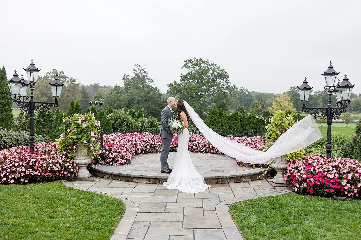Romantic wedding photos of bride and groom surrounded by flowers at Classic Park Savoy wedding