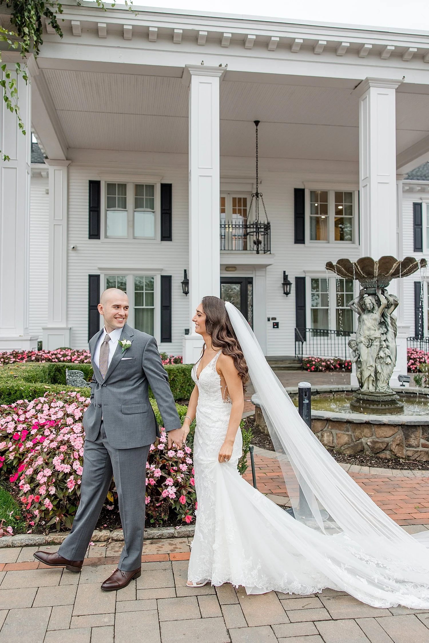  bride and groom walk around Park Savoy estate holding hands 