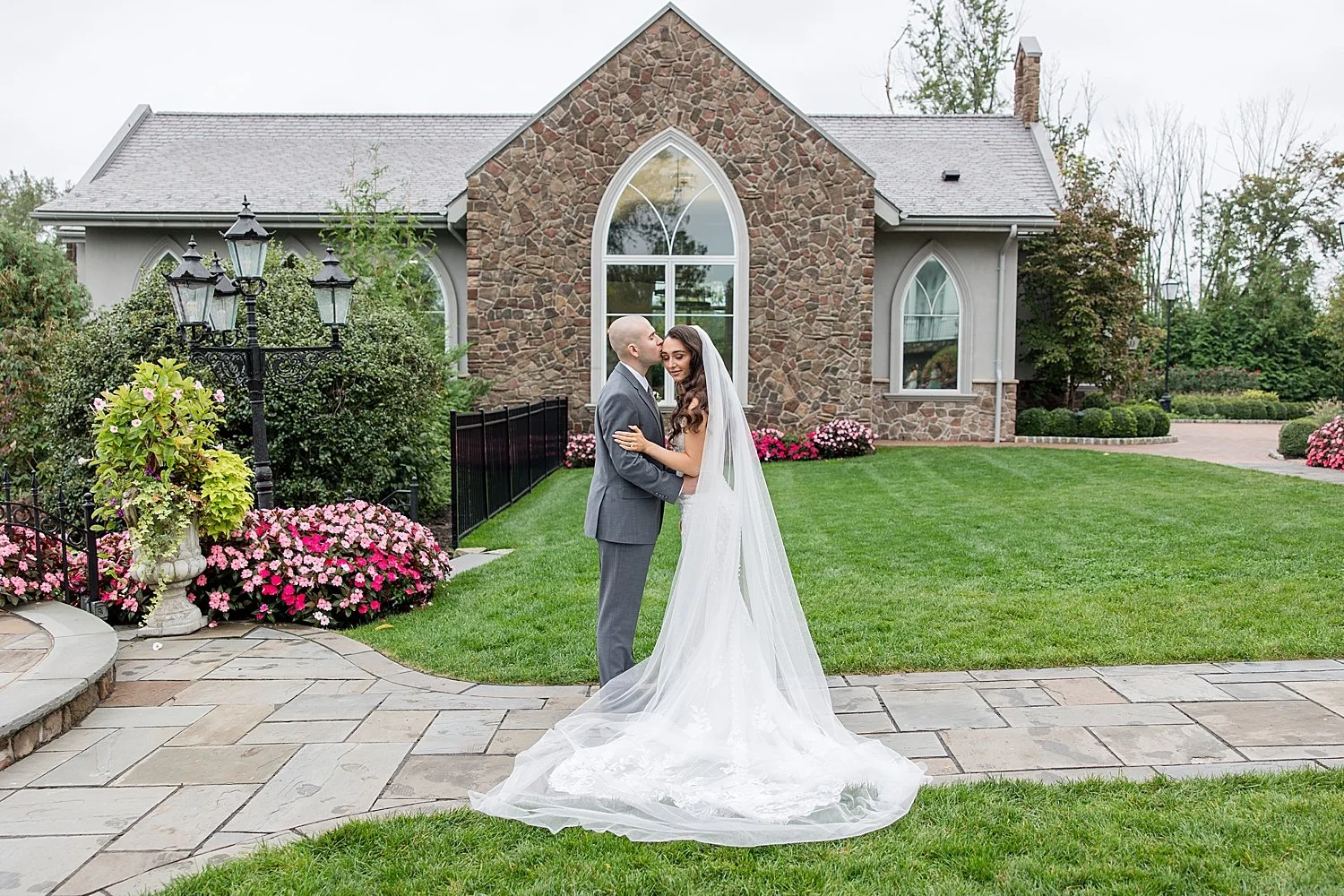  couple kiss in front of building at Park Savoy Estate  
