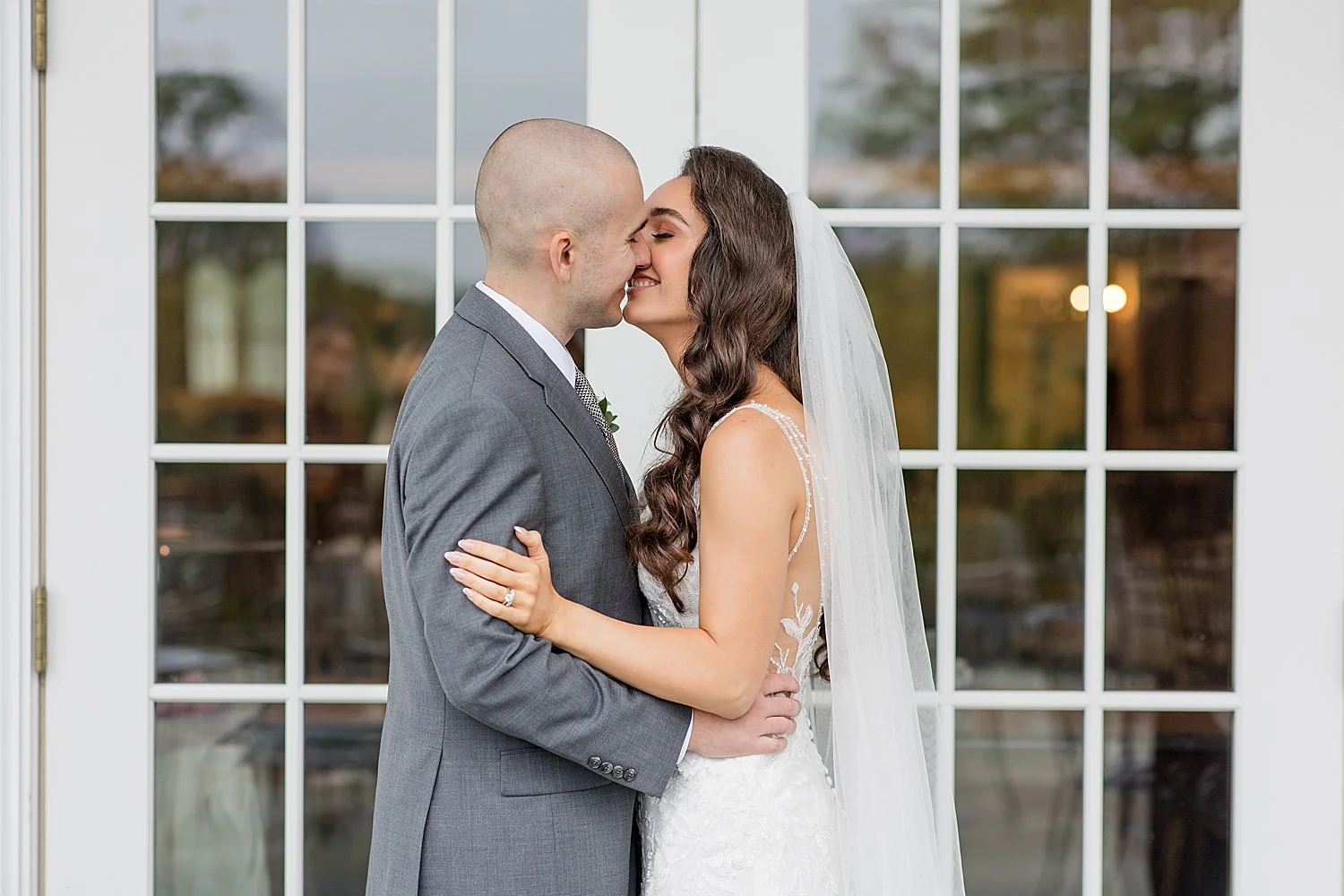  bride and groom kiss during portraits from Classic Park Savoy Wedding in Florian Park, NJ  