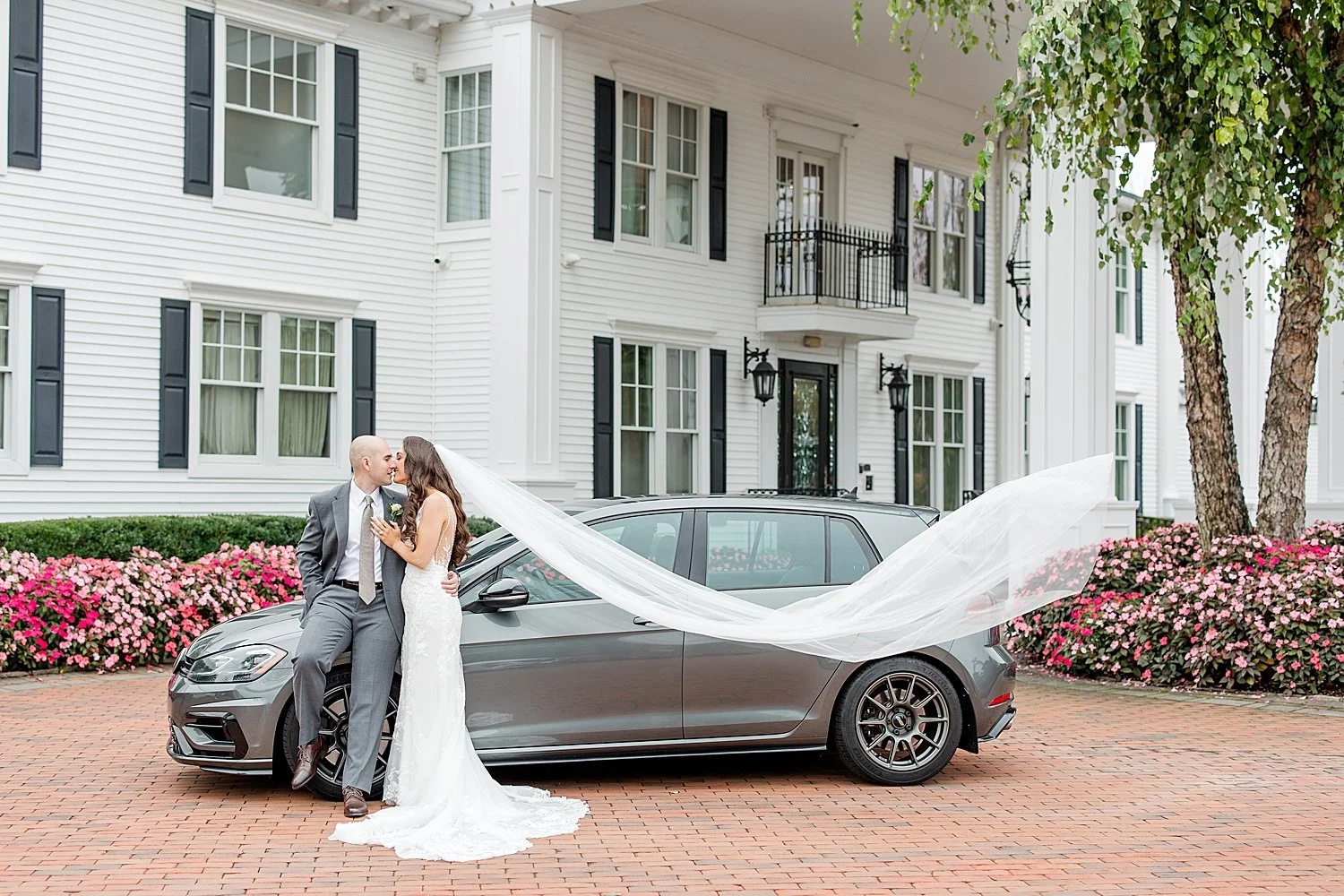 bride and groom portraits by car  